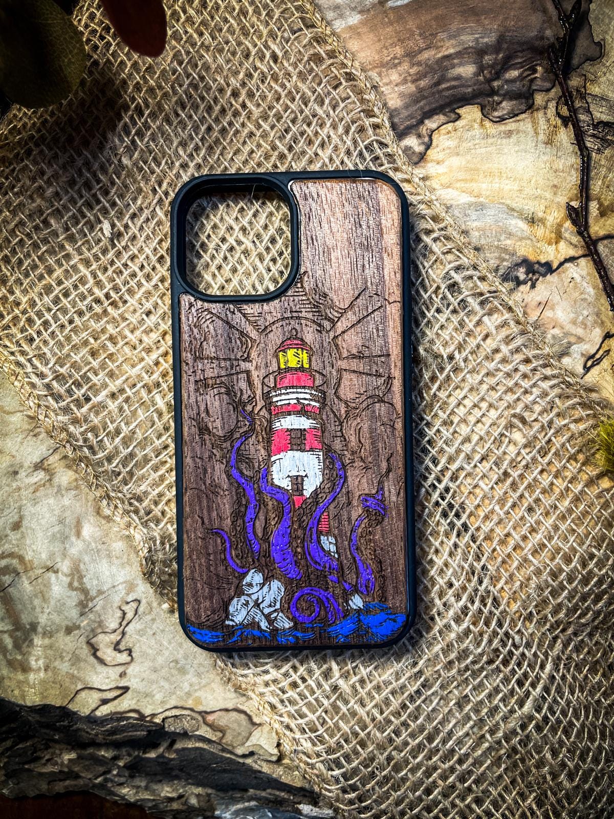 a wooden phone case with an octopus on it