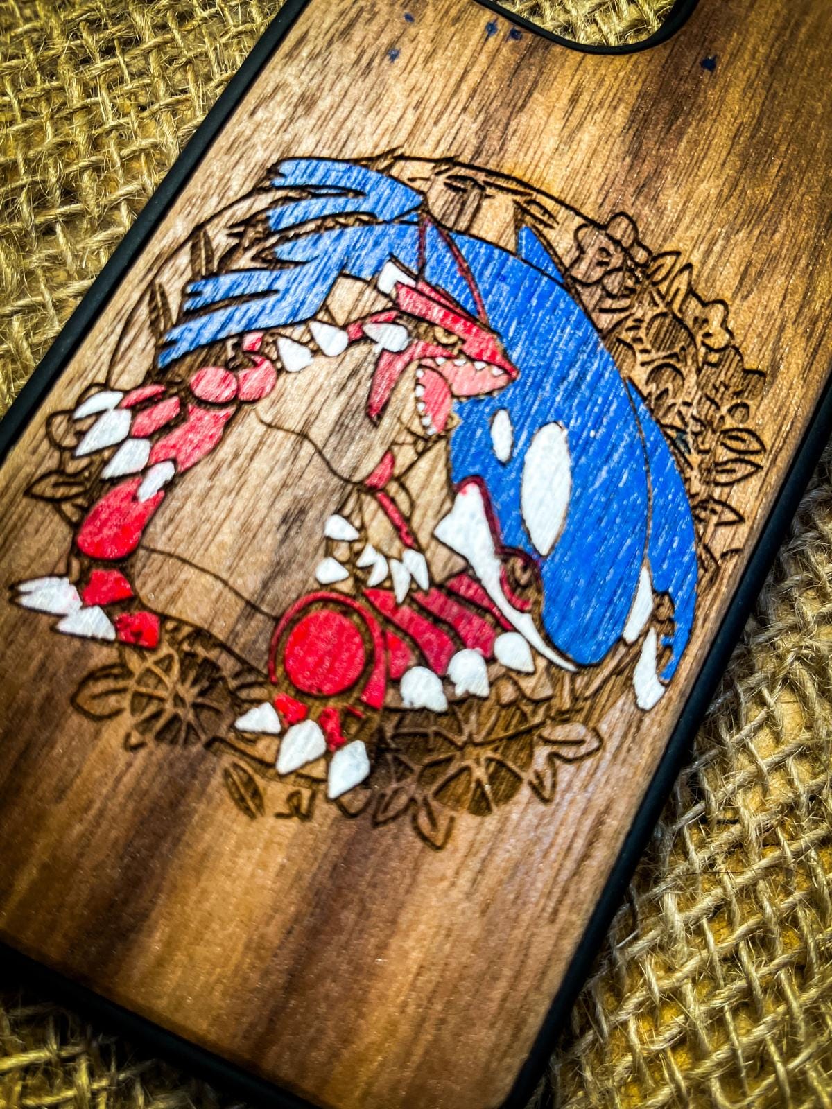 a wooden phone case with a picture of sonic the hedgehog on it