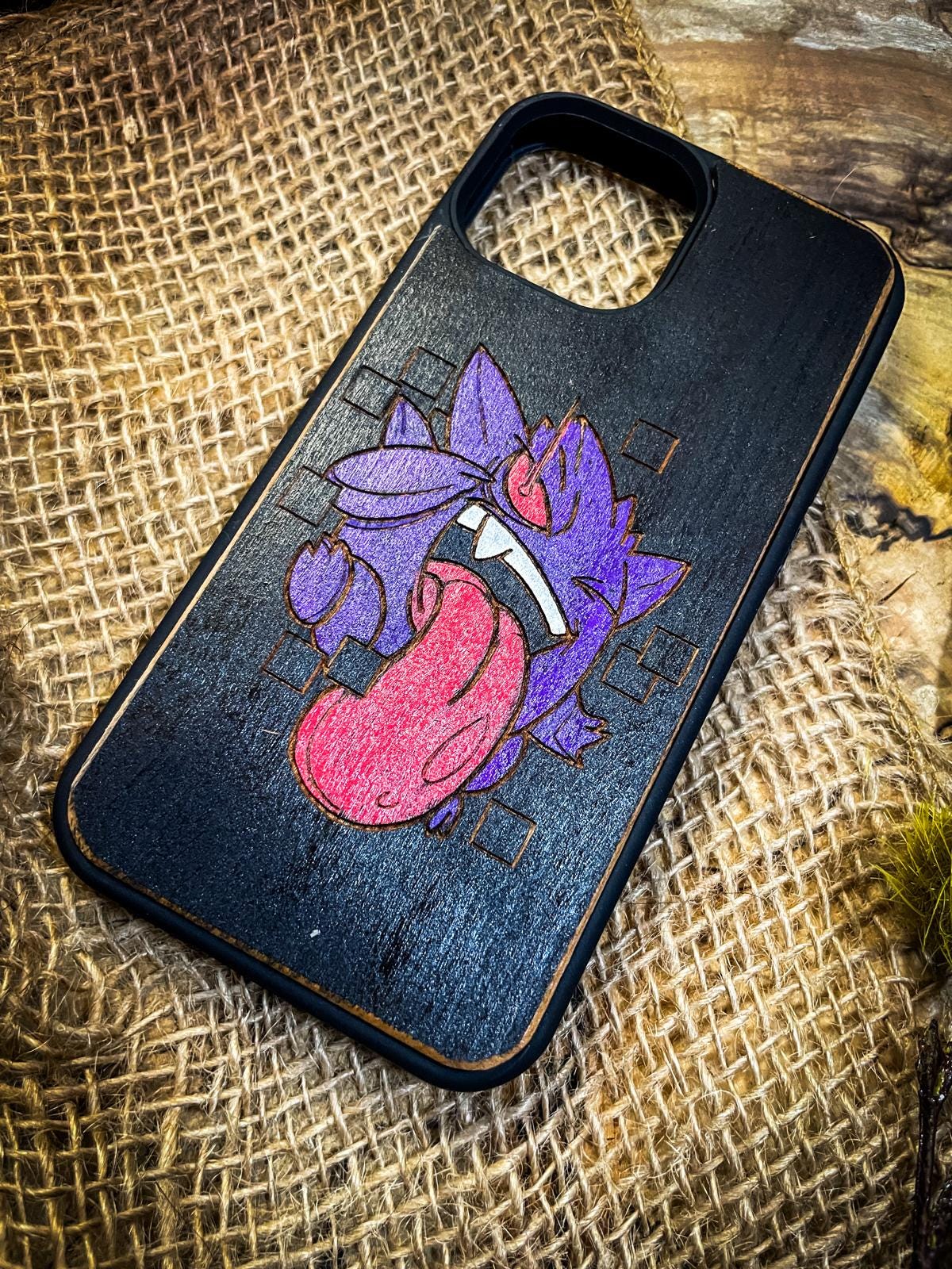 a phone case with a drawing of a cartoon character on it