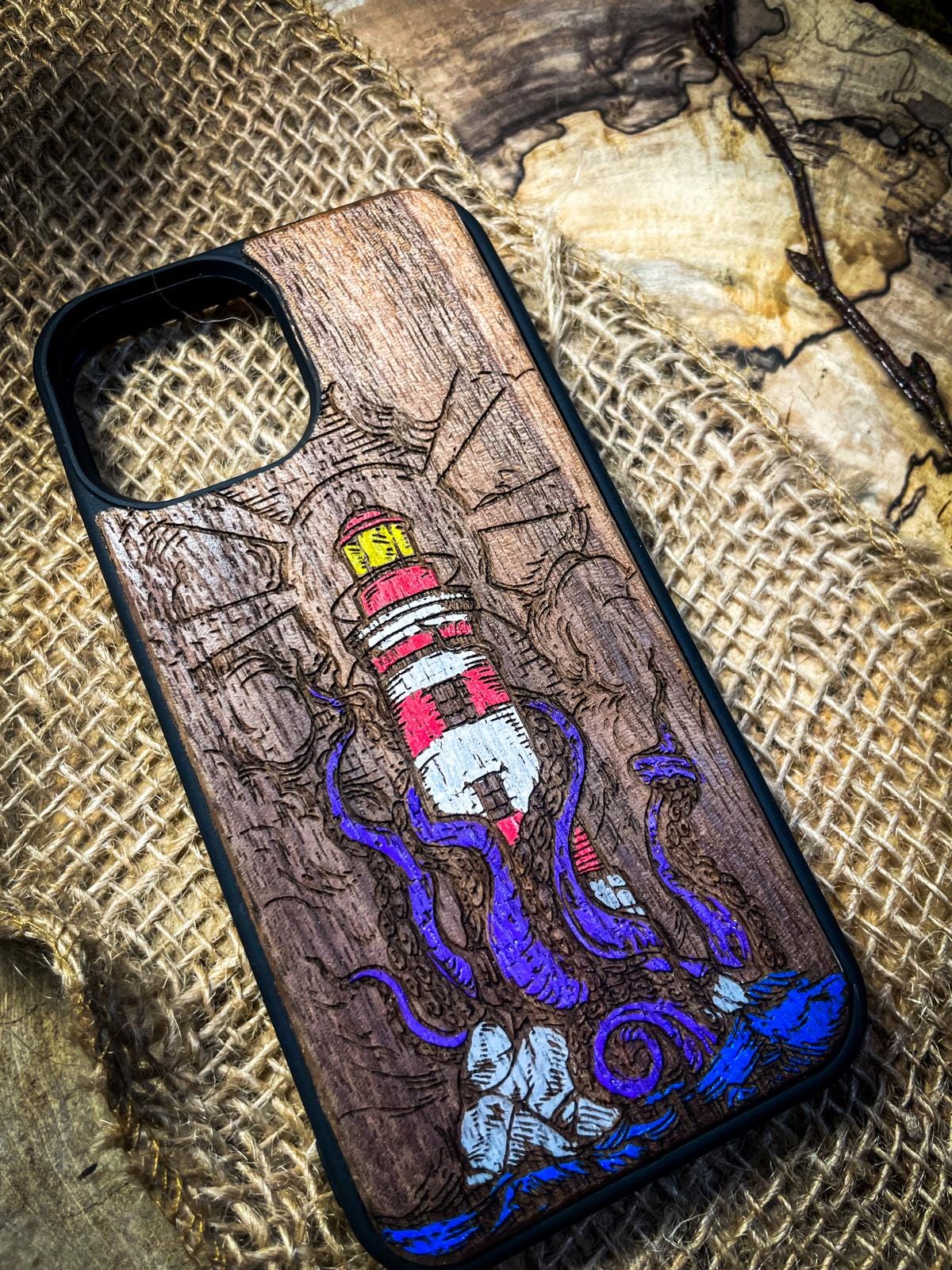 a phone case with a picture of a lighthouse on it