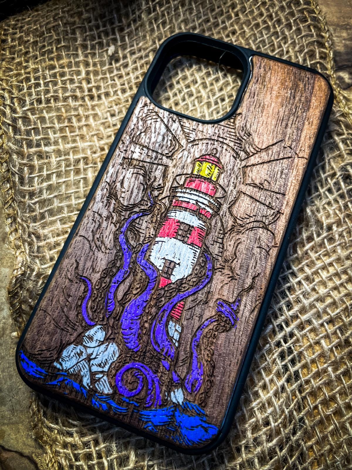 a phone case with a picture of a lighthouse on it