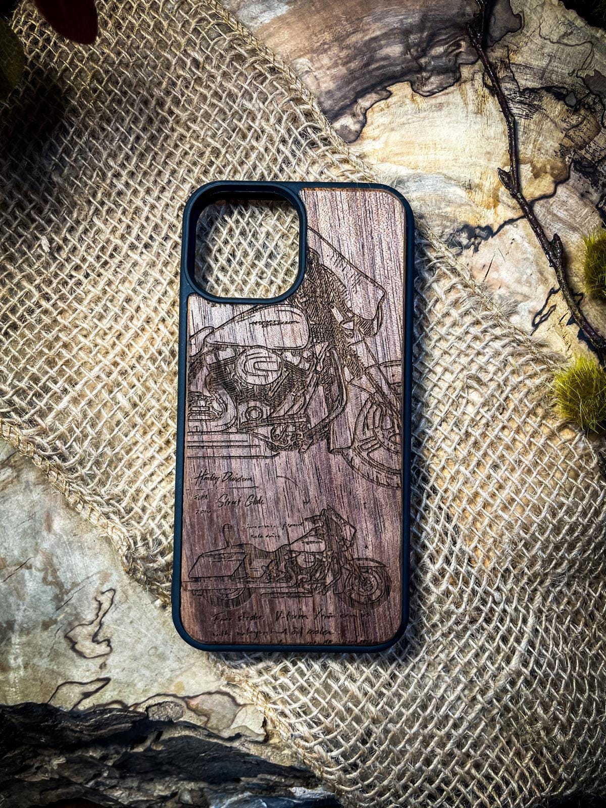 a wooden phone case with a picture of a man on a motorcycle