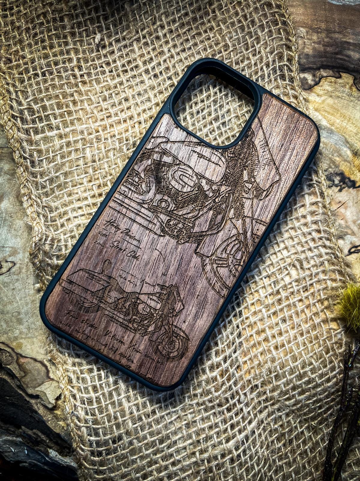 a wooden phone case with a picture of a man on a motorcycle