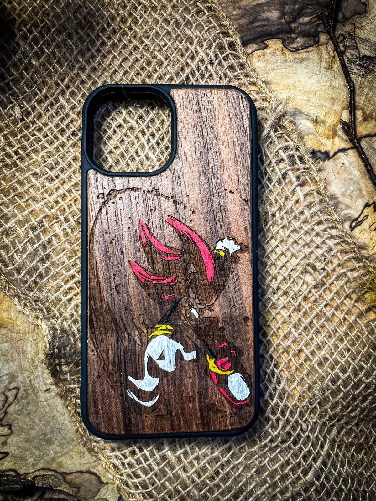 a wooden phone case with a cartoon character on it