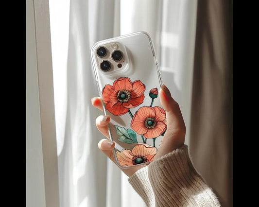 a woman holding a phone case with flowers painted on it