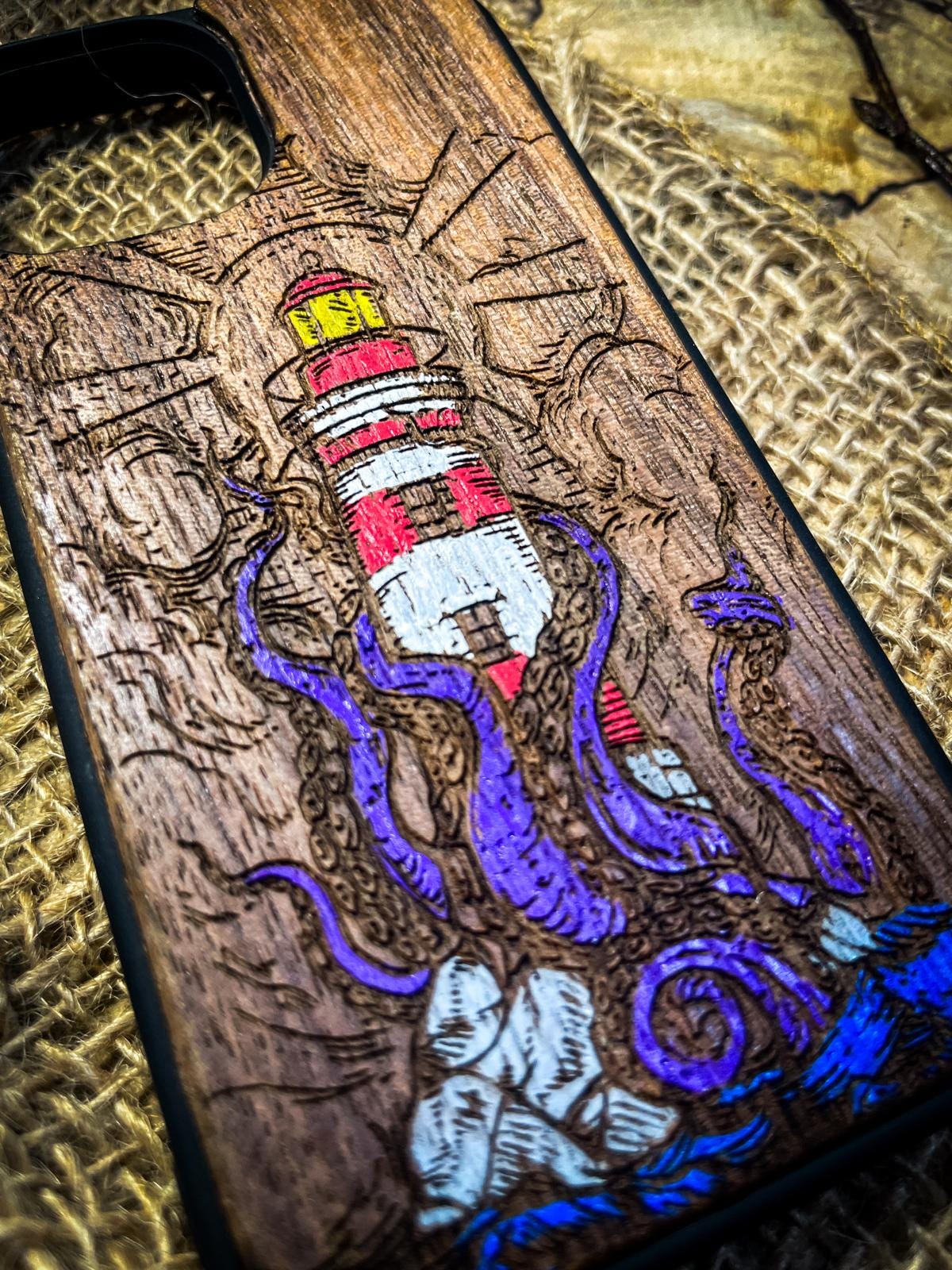 a wooden phone case with an octopus on it