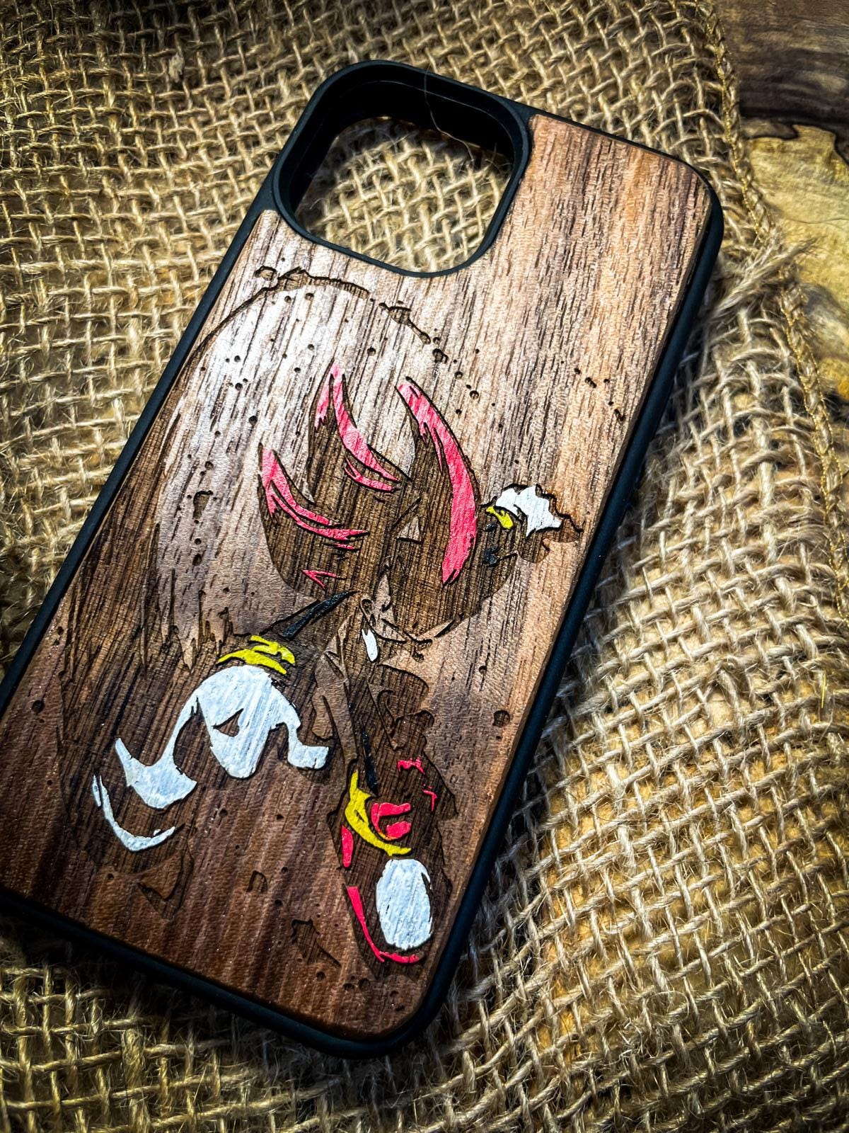 a wooden phone case with a picture of a bird on it