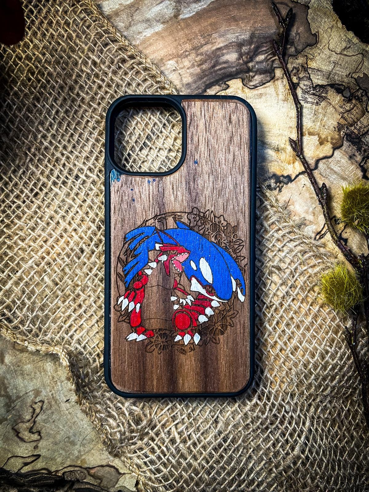 a wooden phone case with a picture of sonic the hedgehog on it