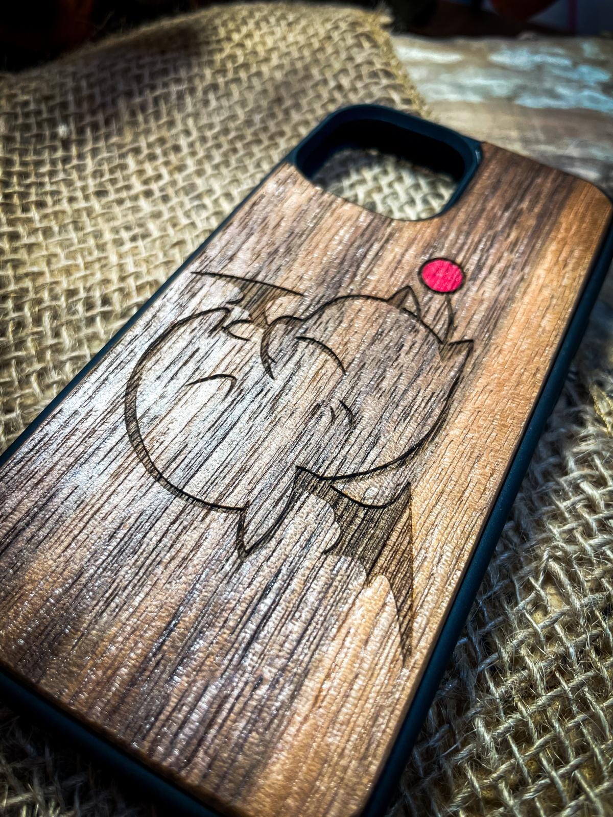 a wooden phone case with a picture of an elephant on it