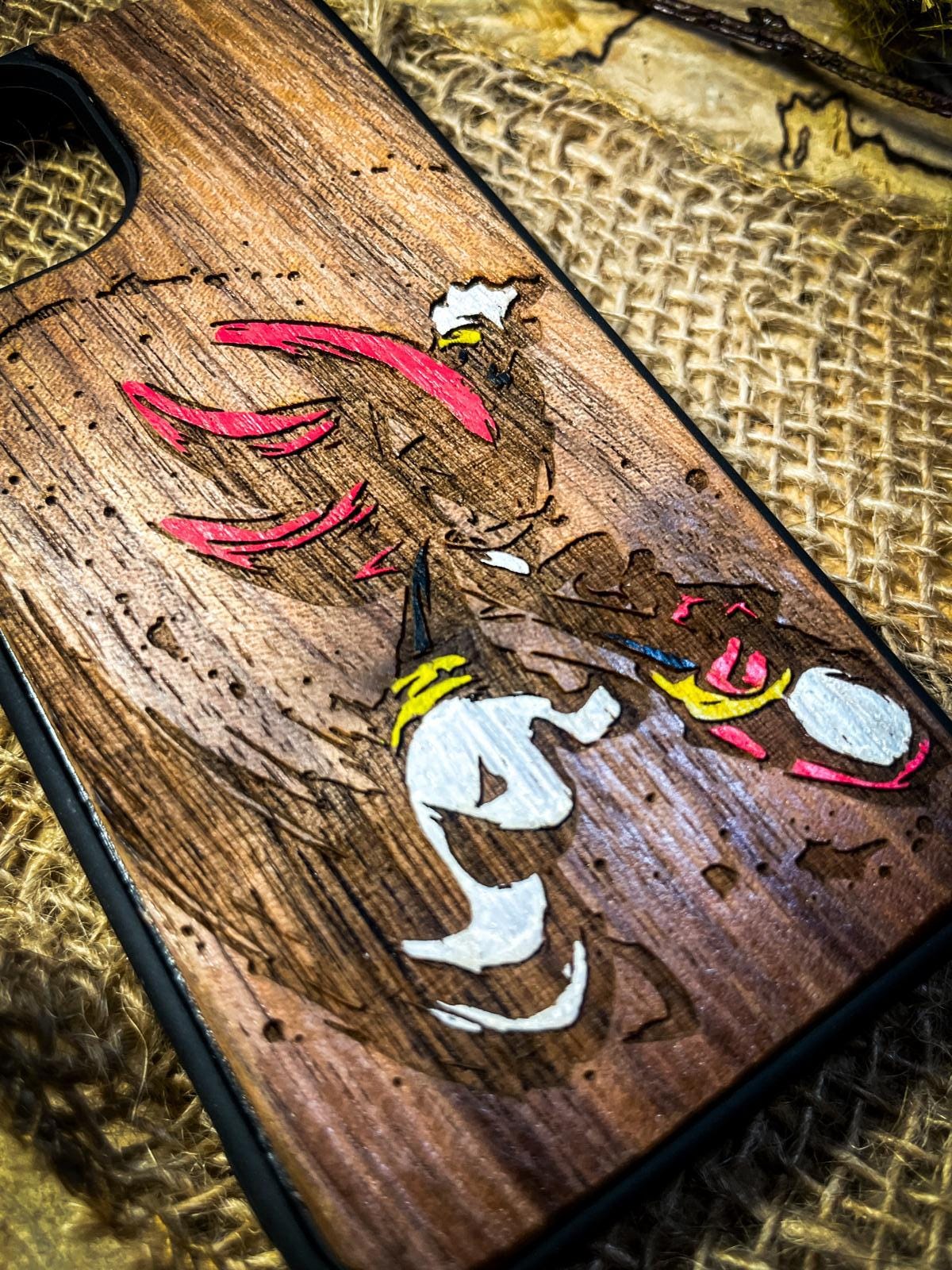 a wooden phone case with a picture of a deer