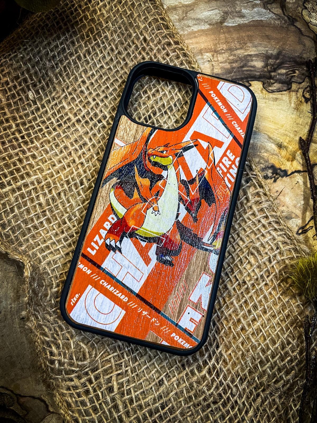 a phone case sitting on top of a piece of wood