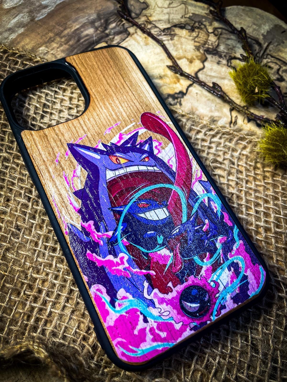 a wooden phone case with a painting on it