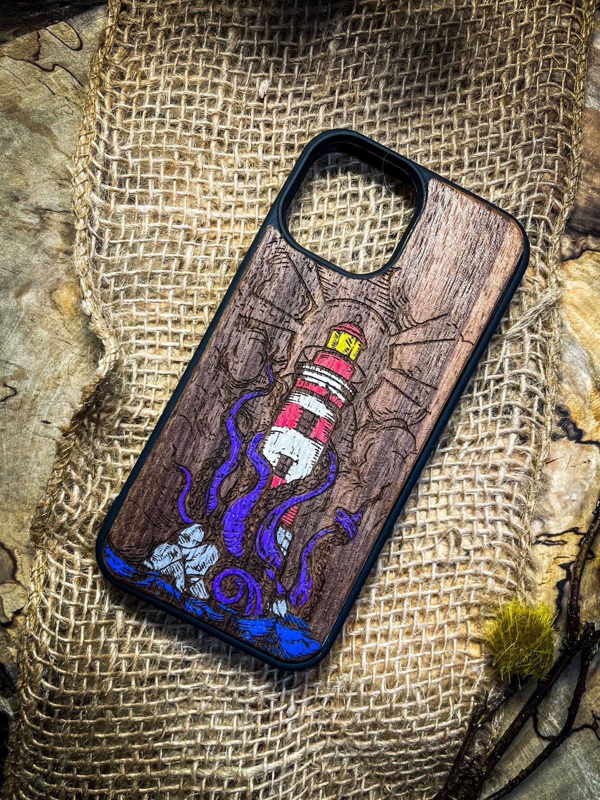 a phone case with a picture of a lighthouse on it