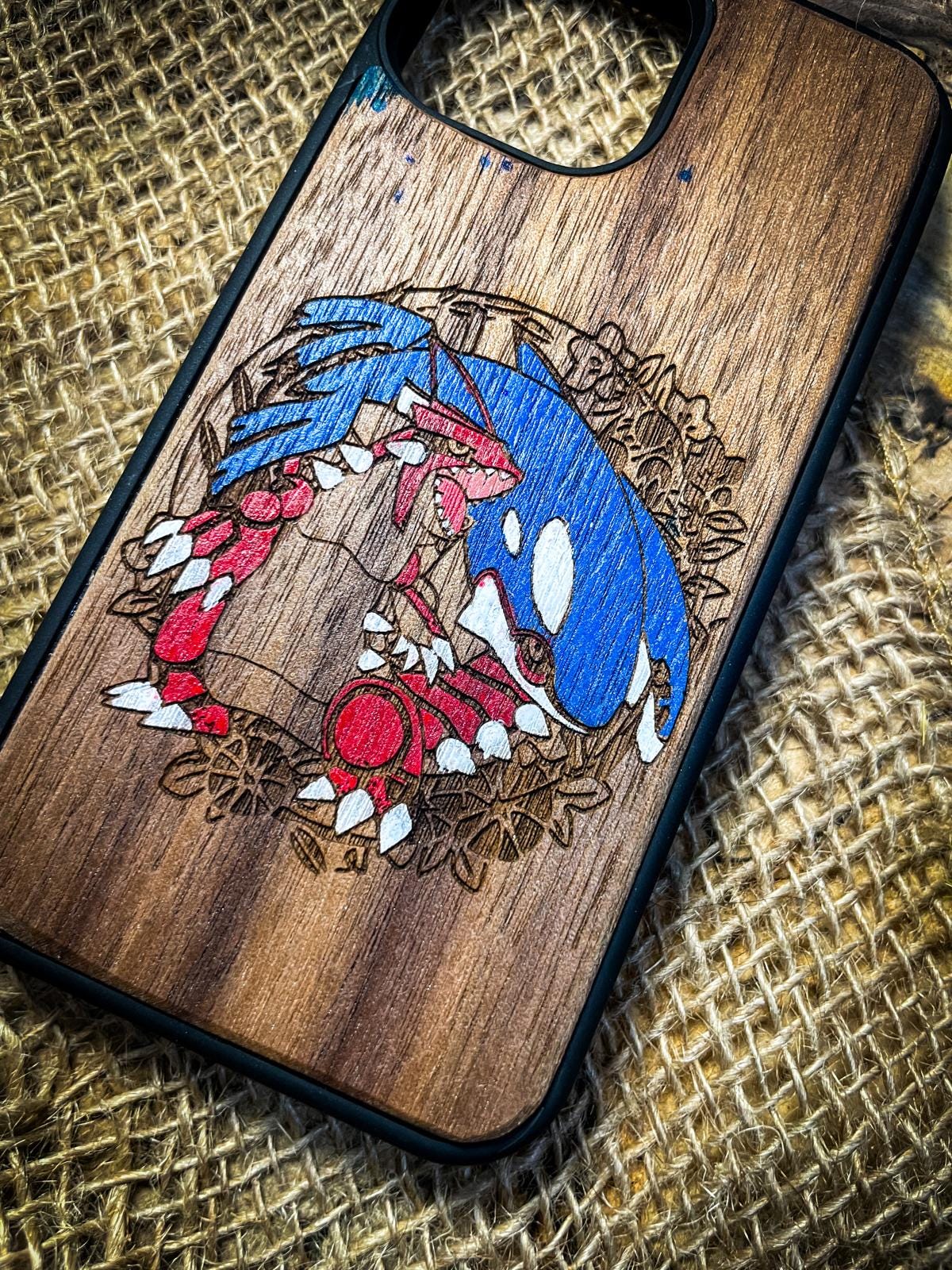 a wooden phone case with a picture of sonic the hedgehog on it