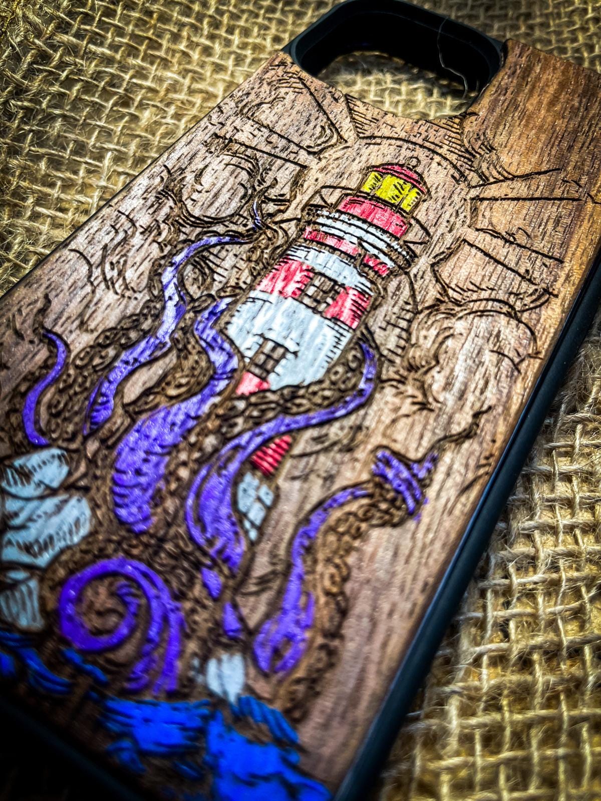 a wooden phone case with an octopus on it