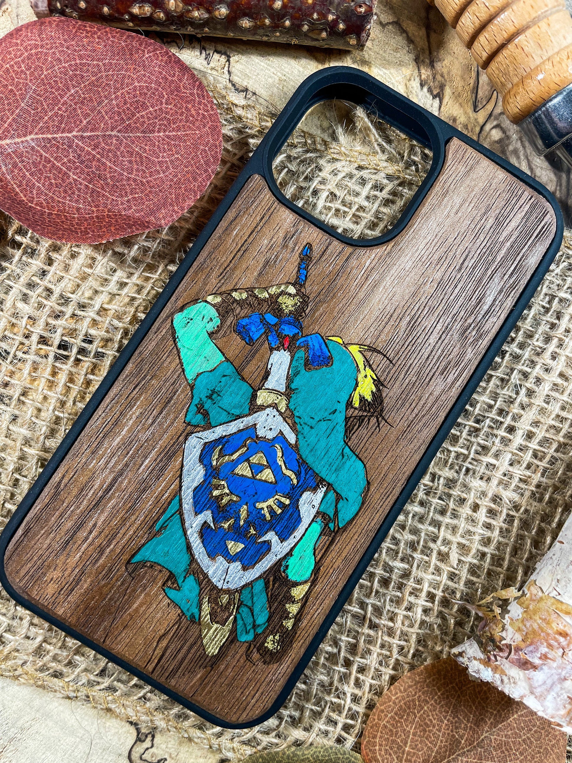 a wooden phone case with a picture of a knight on it