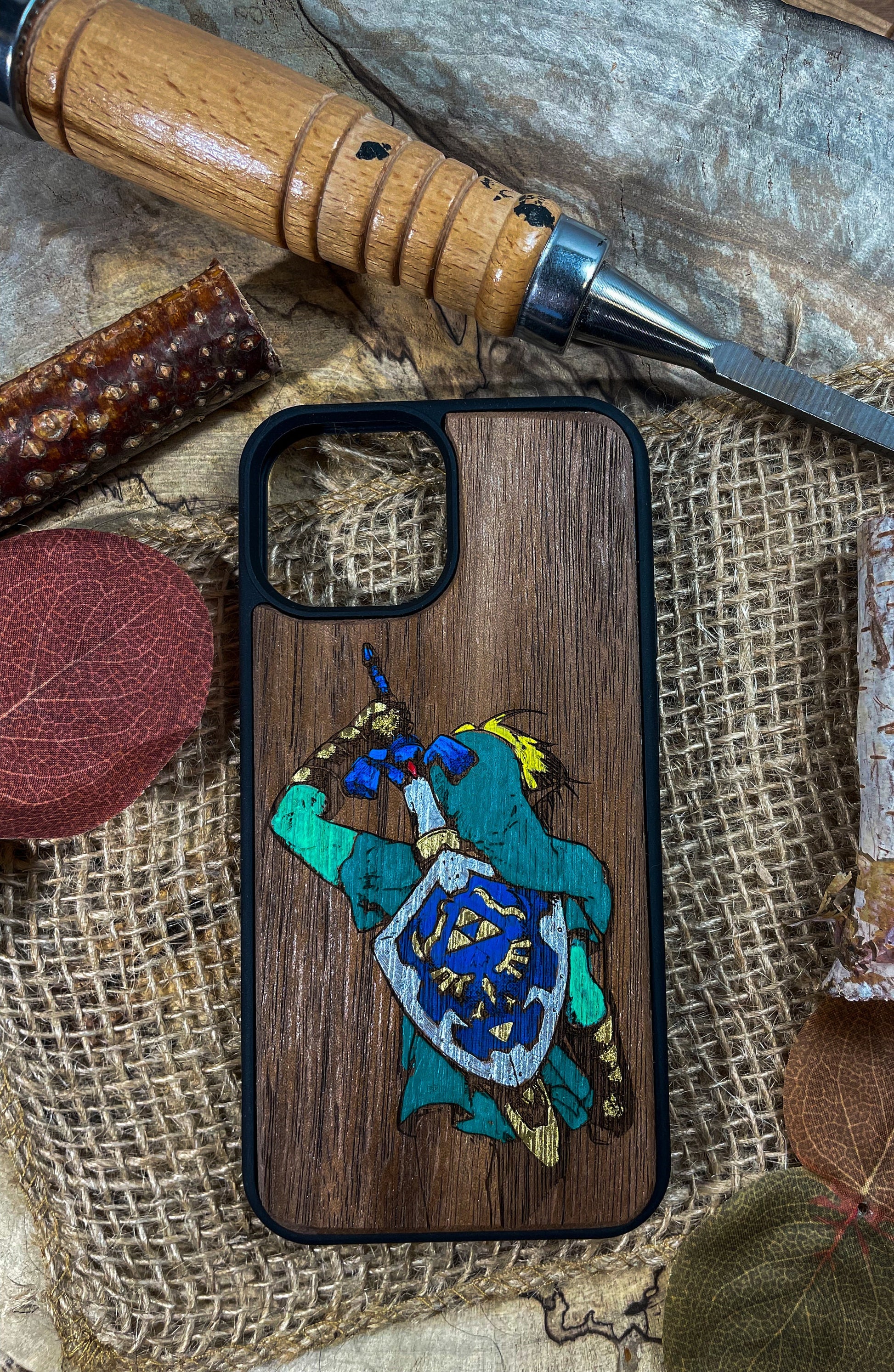 a wooden phone case with a picture of a turtle on it