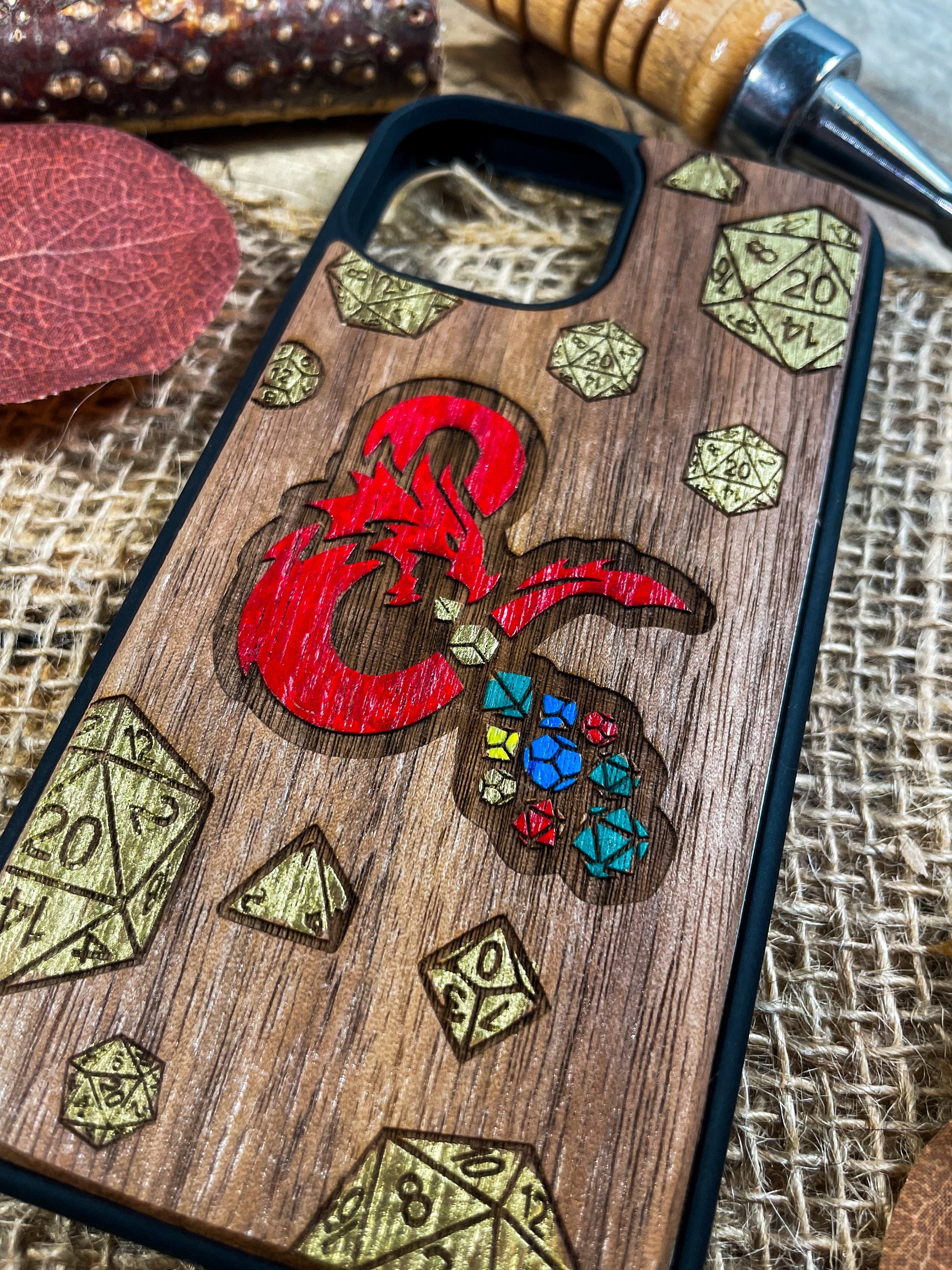 a wooden phone case with a picture of a dragon on it