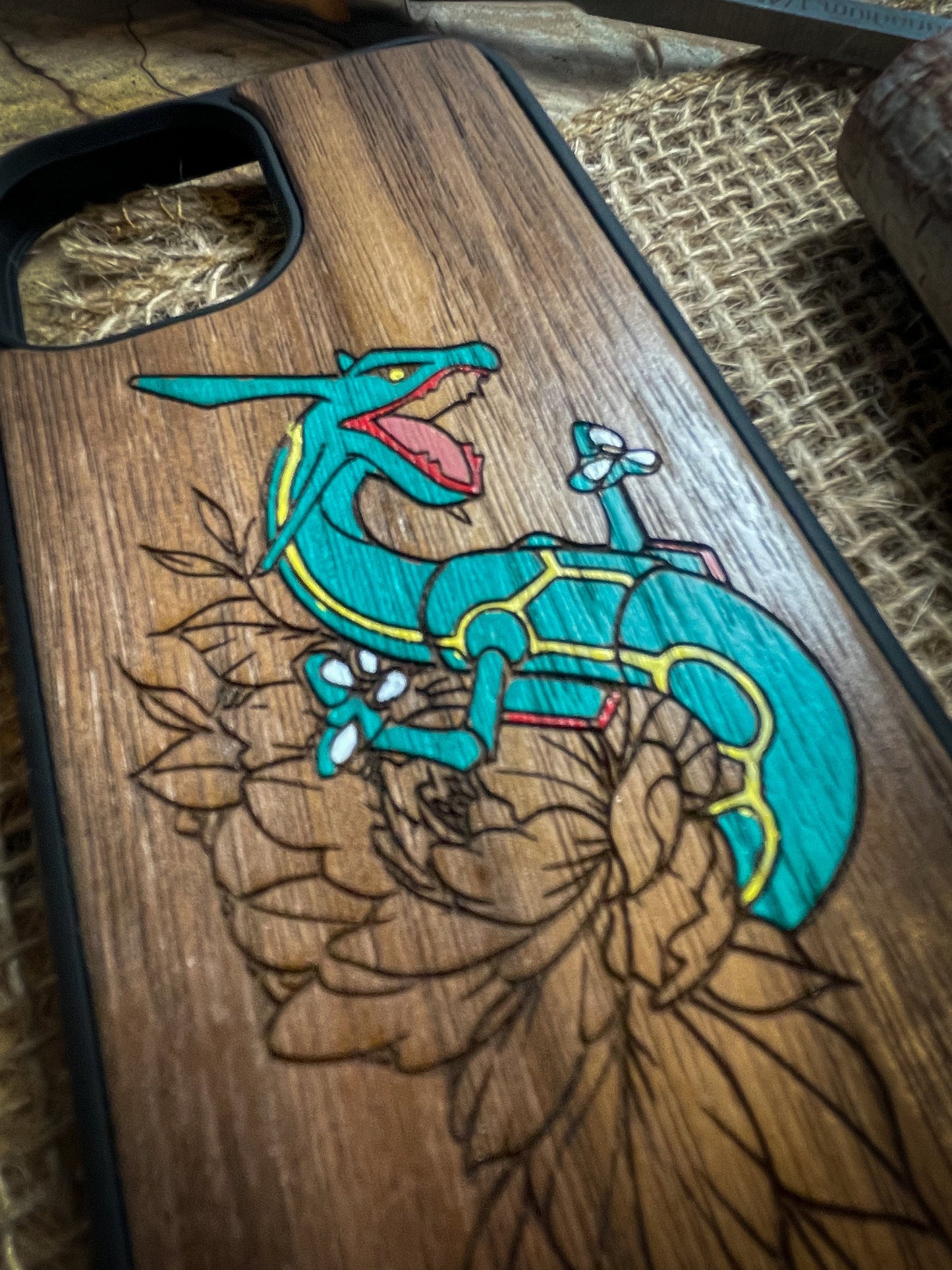 a wooden phone case with an image of a lizard on it