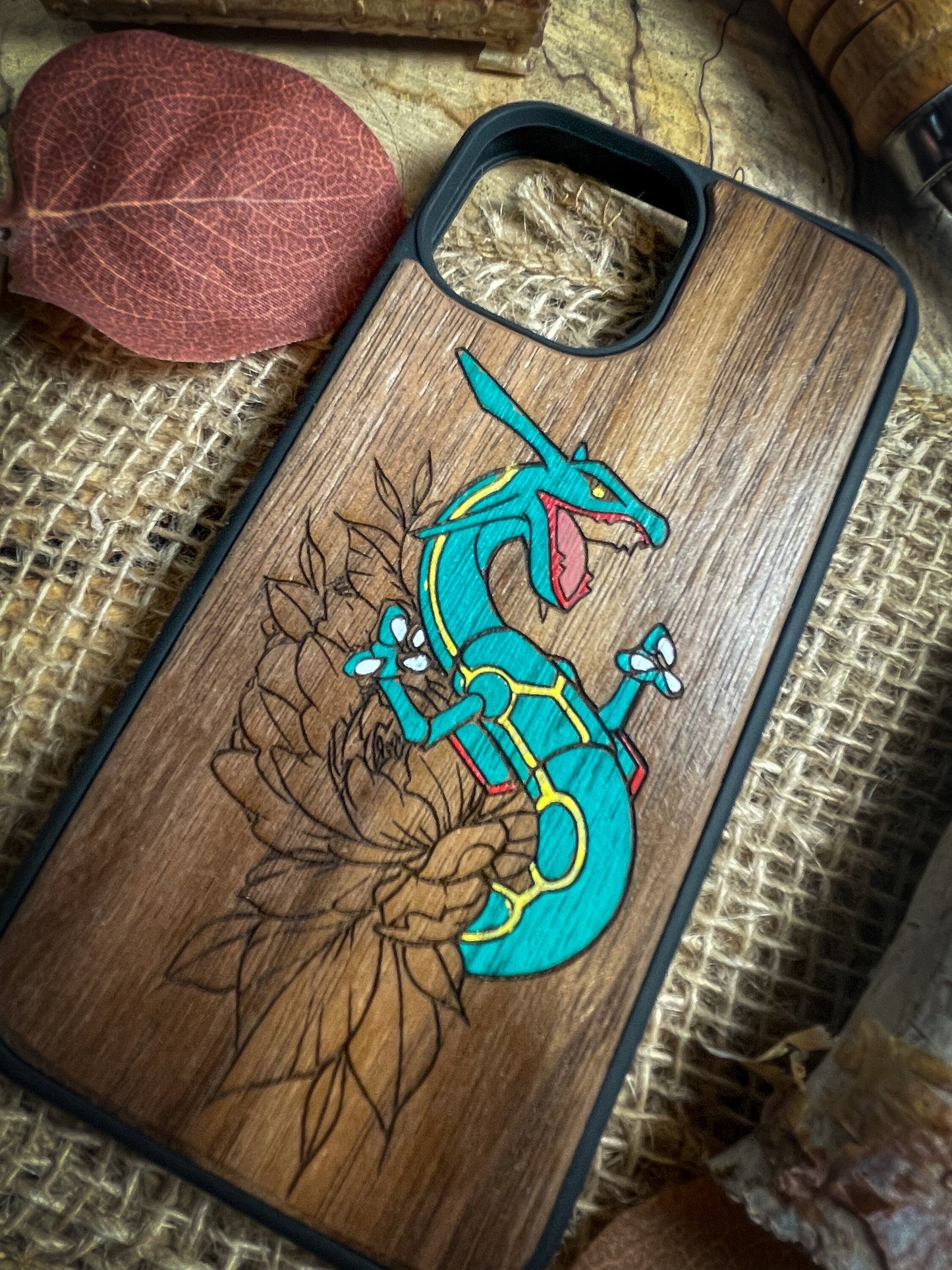 a wooden phone case with an image of a dragon on it