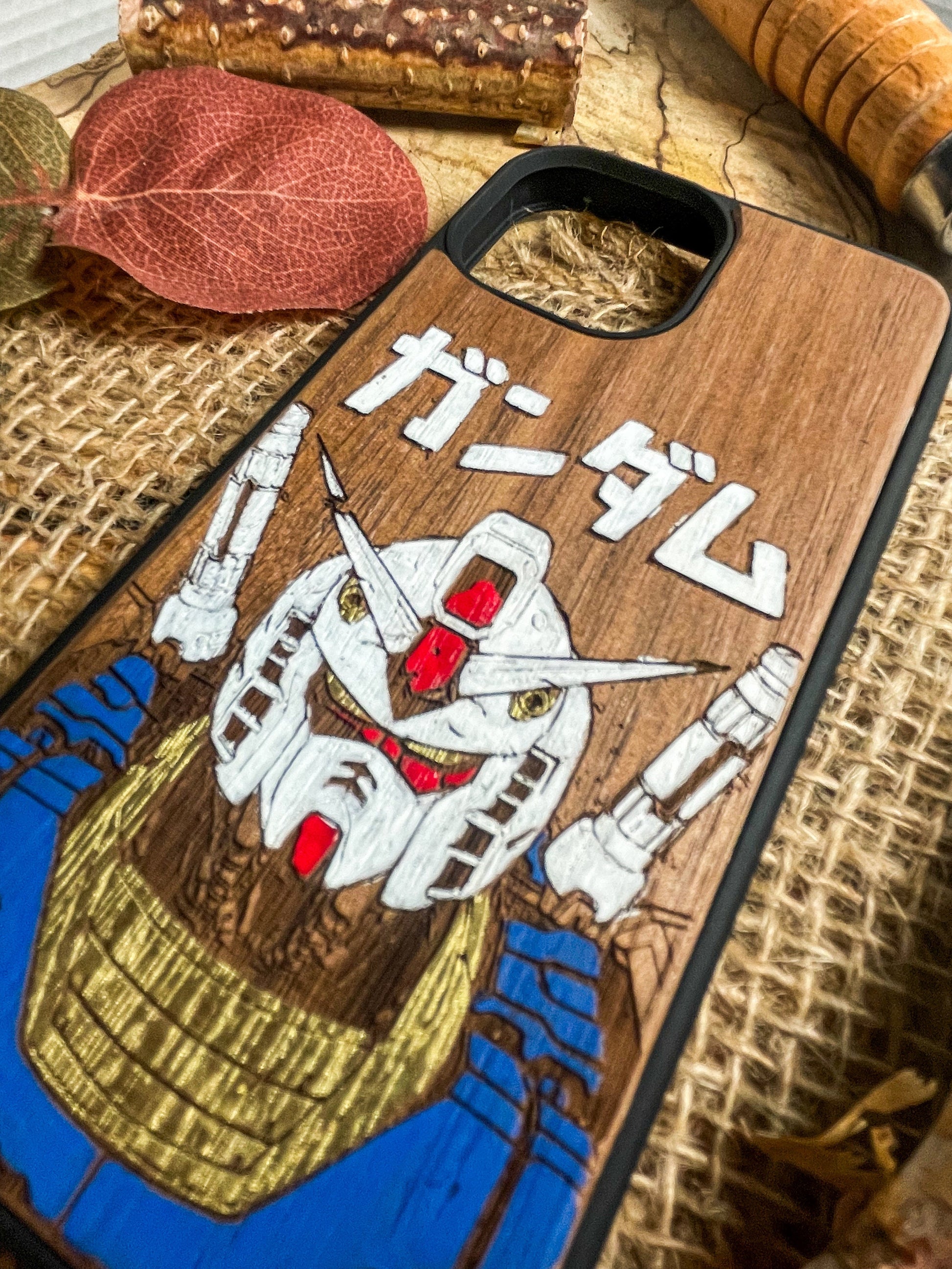 a wooden phone case with a picture of a pirate on it