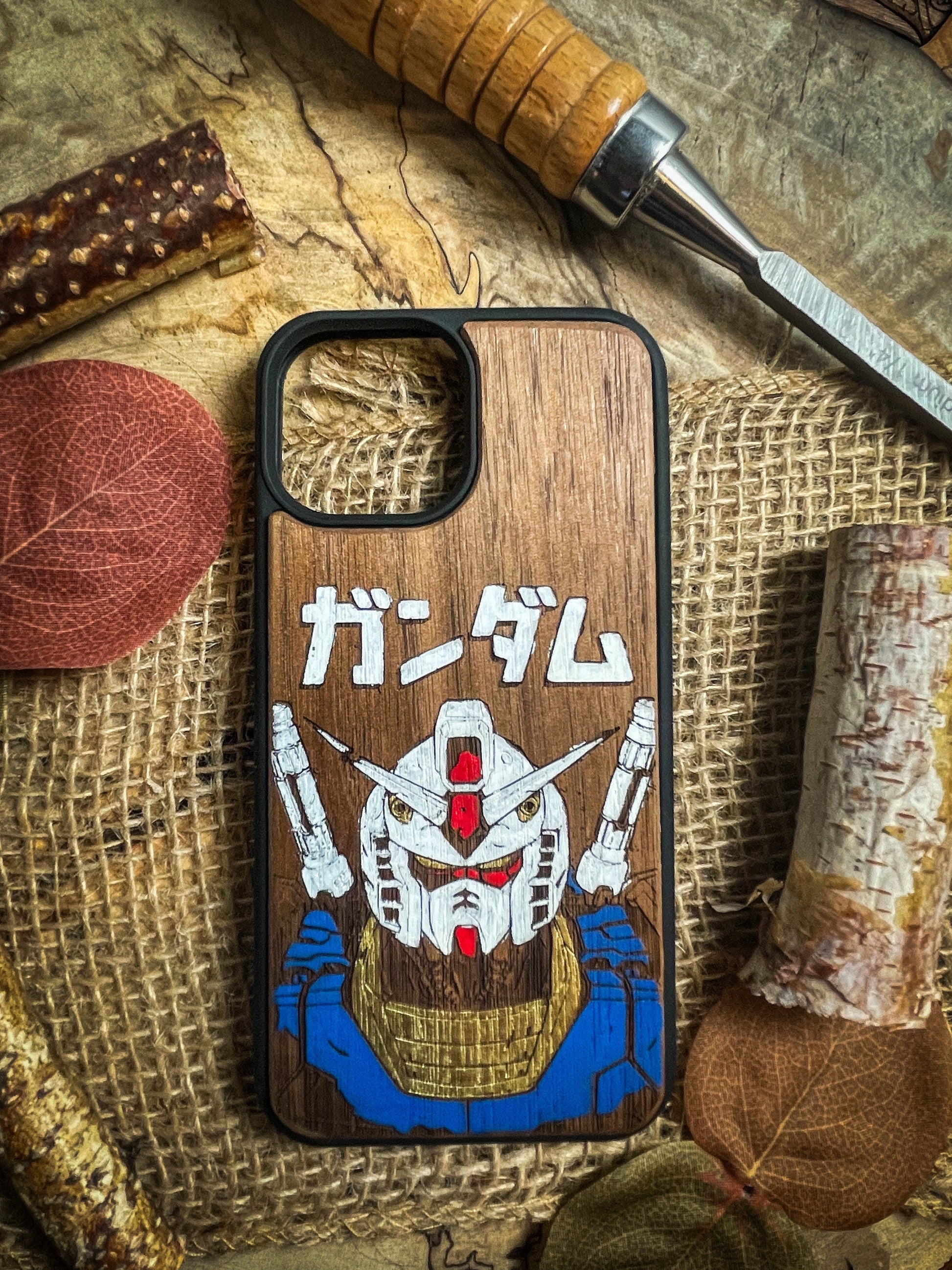 a wooden phone case with a picture of a samurai on it