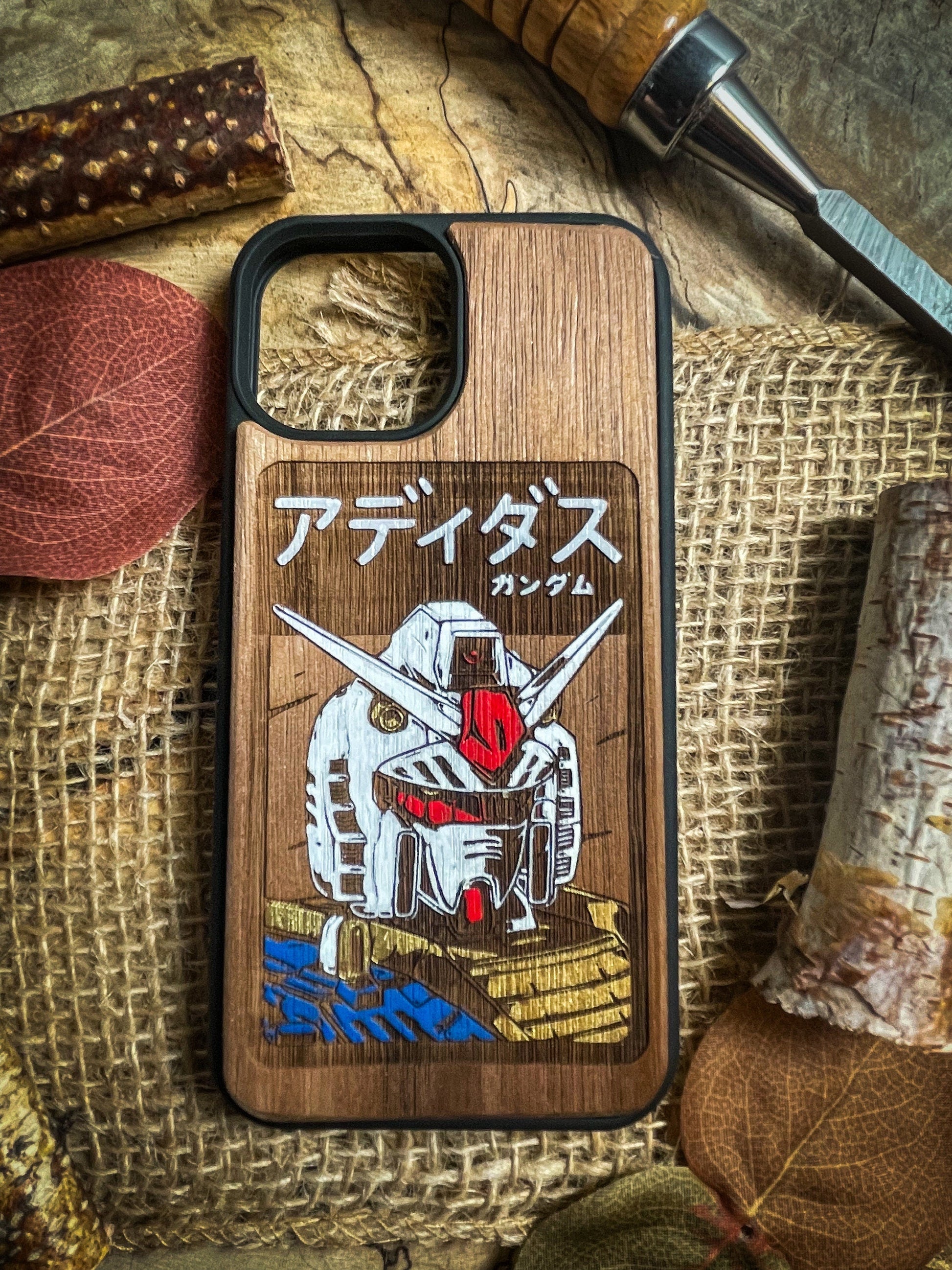 a wooden phone case with a picture of a robot on it