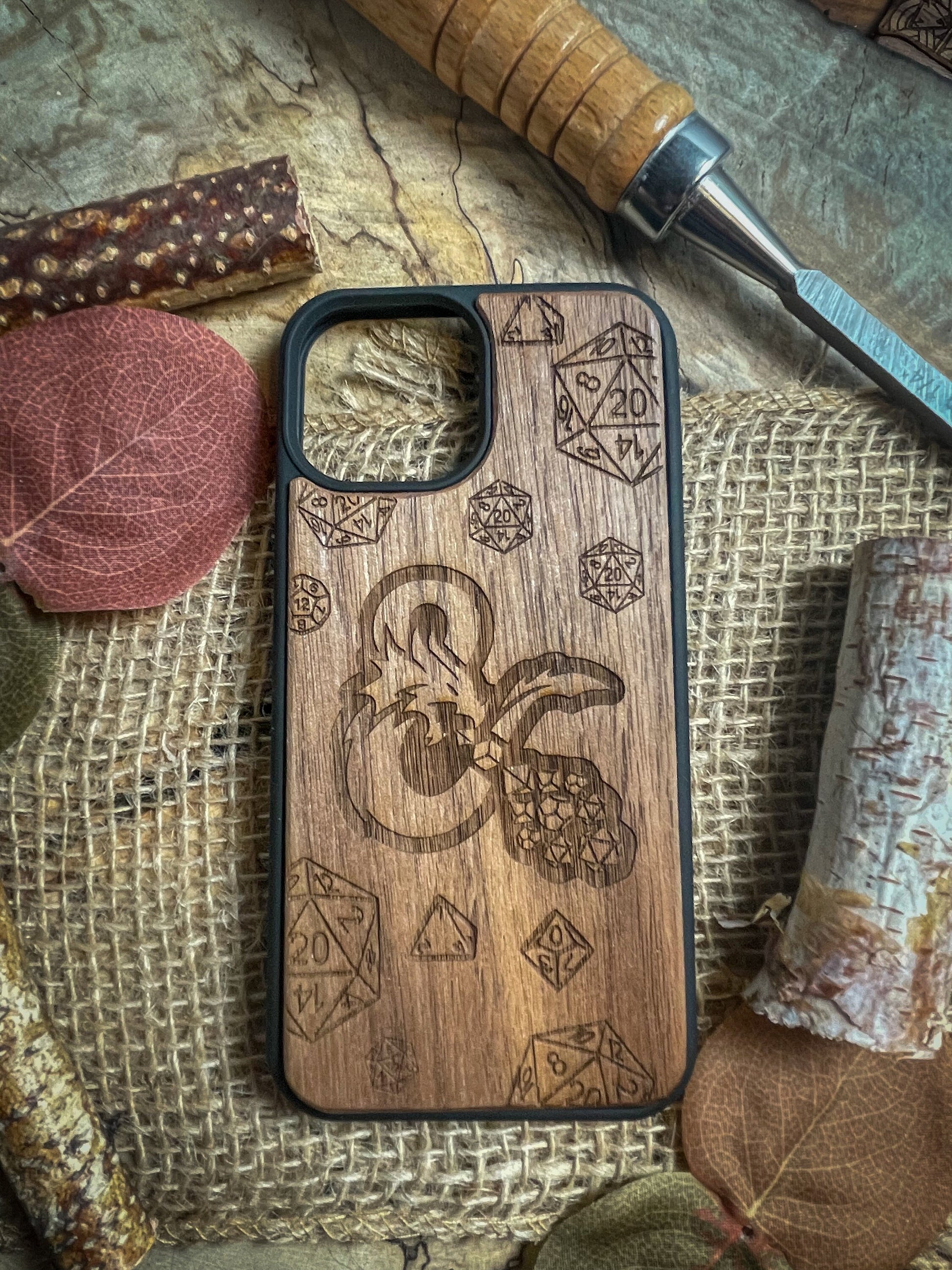 a wooden phone case sitting on top of a table