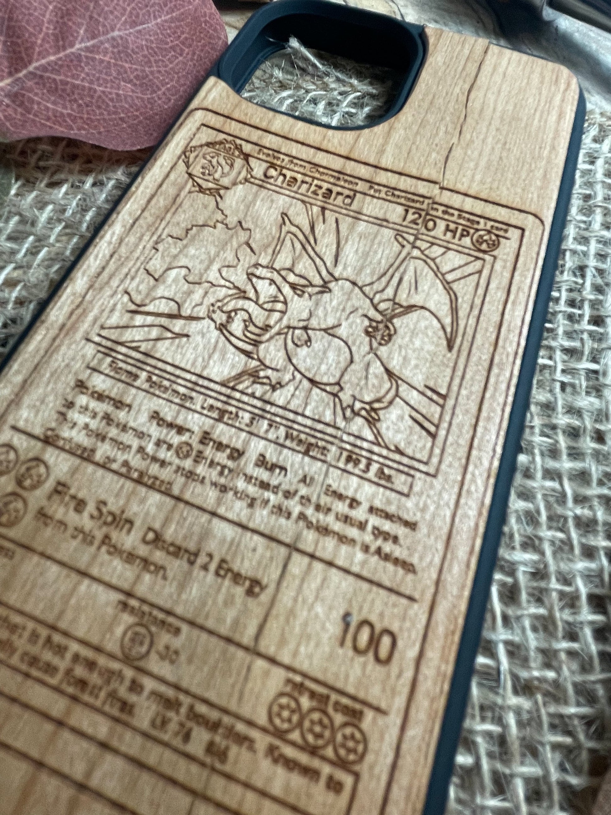 a wooden phone case with a picture of a dragon on it