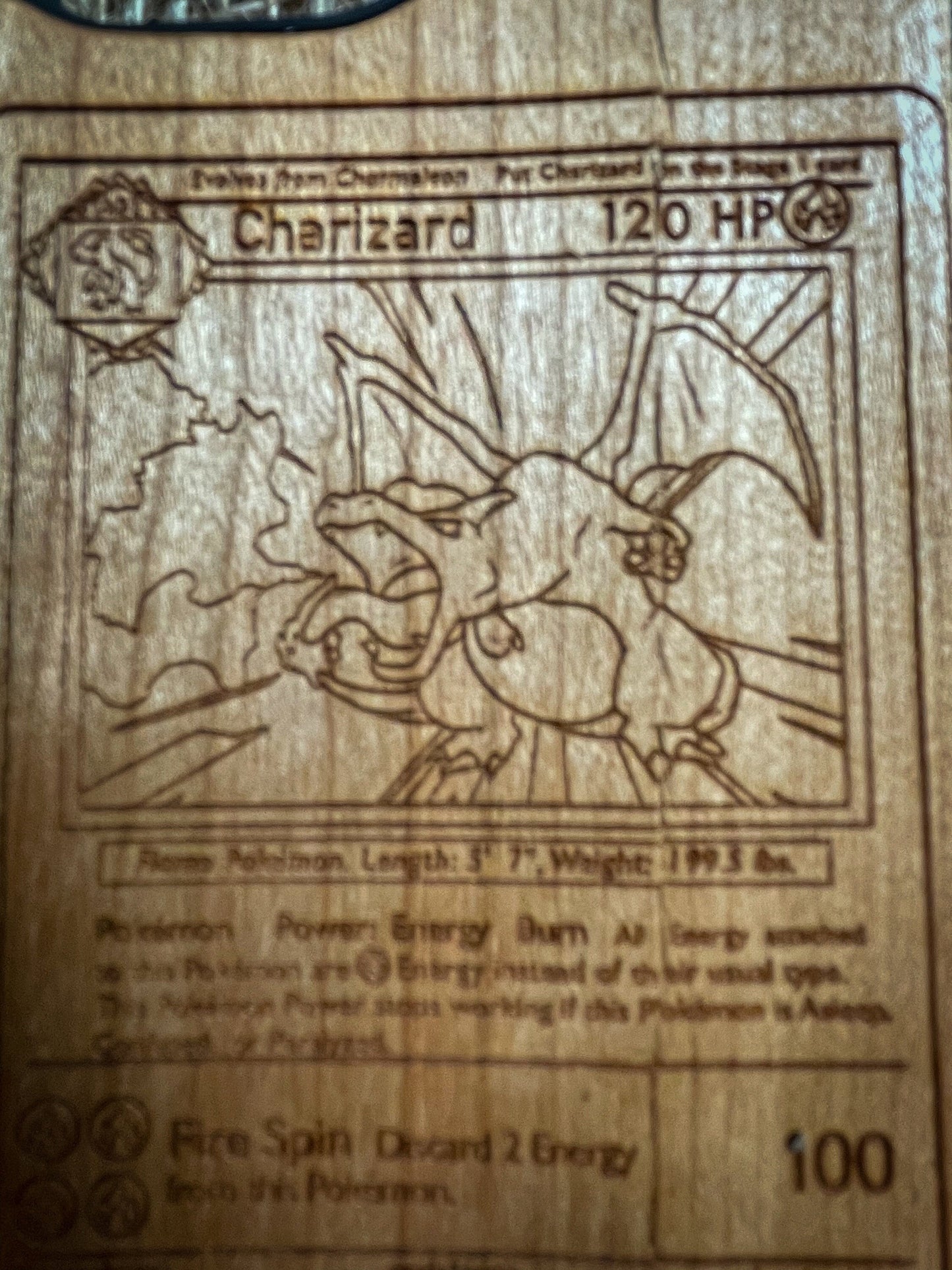 a wooden plaque with a picture of a pokemon character on it