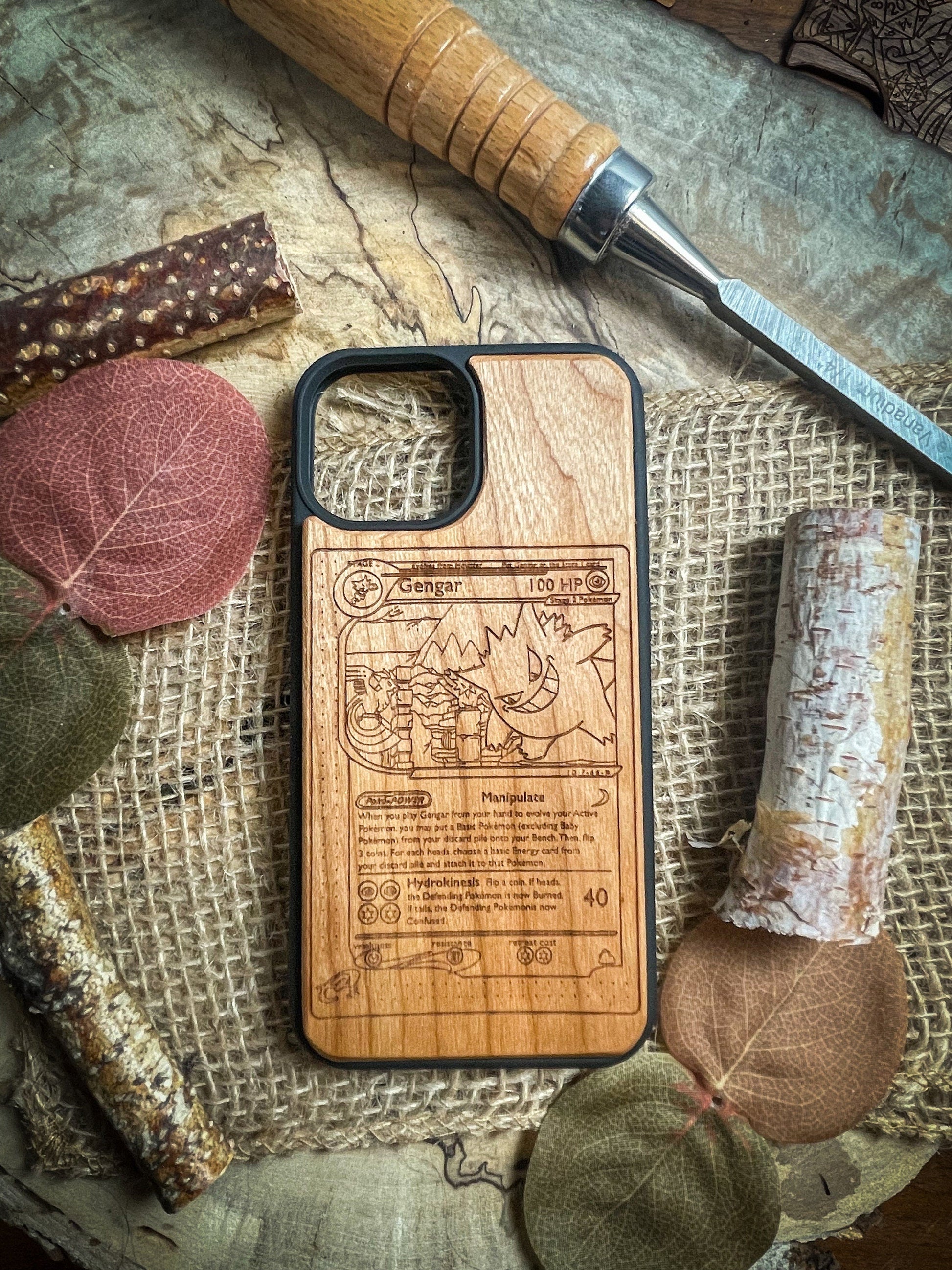 a wooden phone case sitting on top of a table