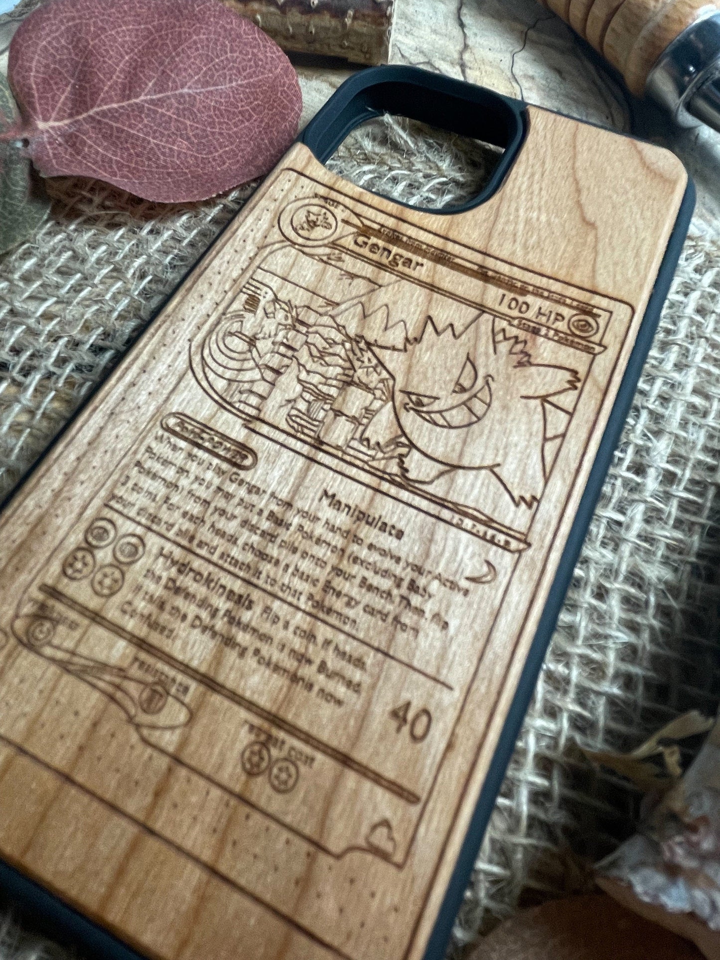 a wooden phone case sitting on top of a table