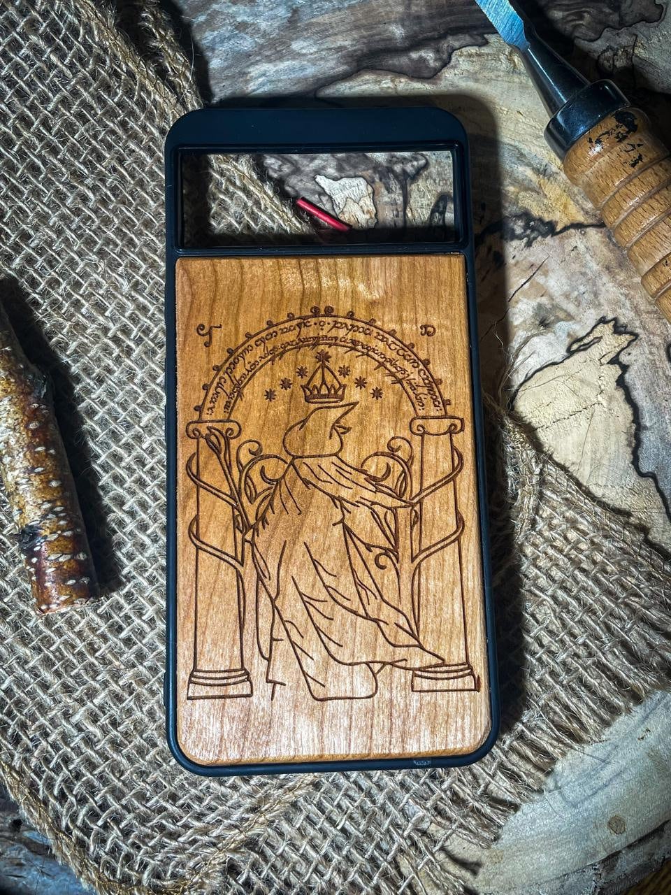 a wooden phone case with a picture of an angel on it