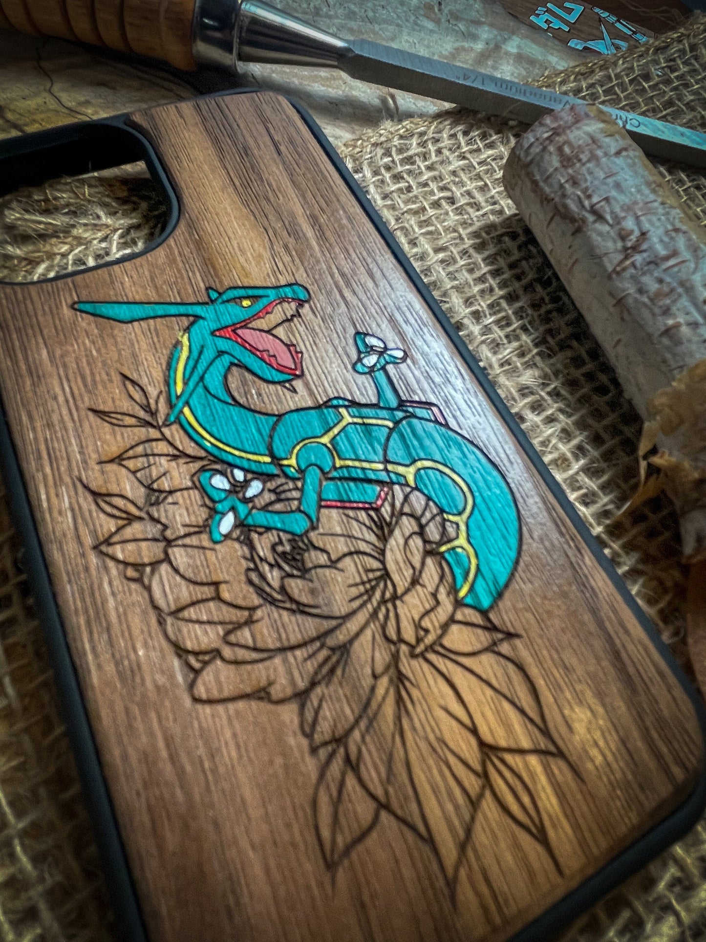 a wooden phone case with a lizard on it