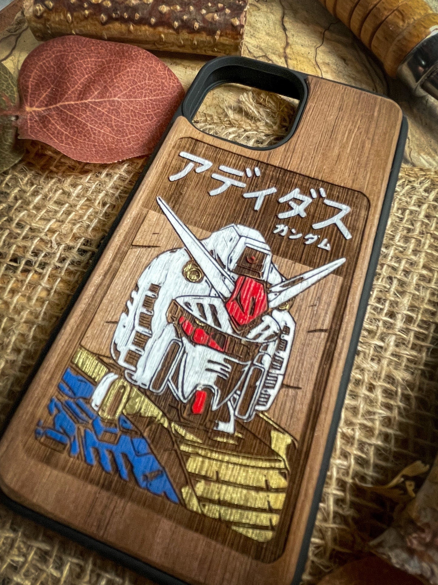 a wooden phone case with a picture of a robot on it