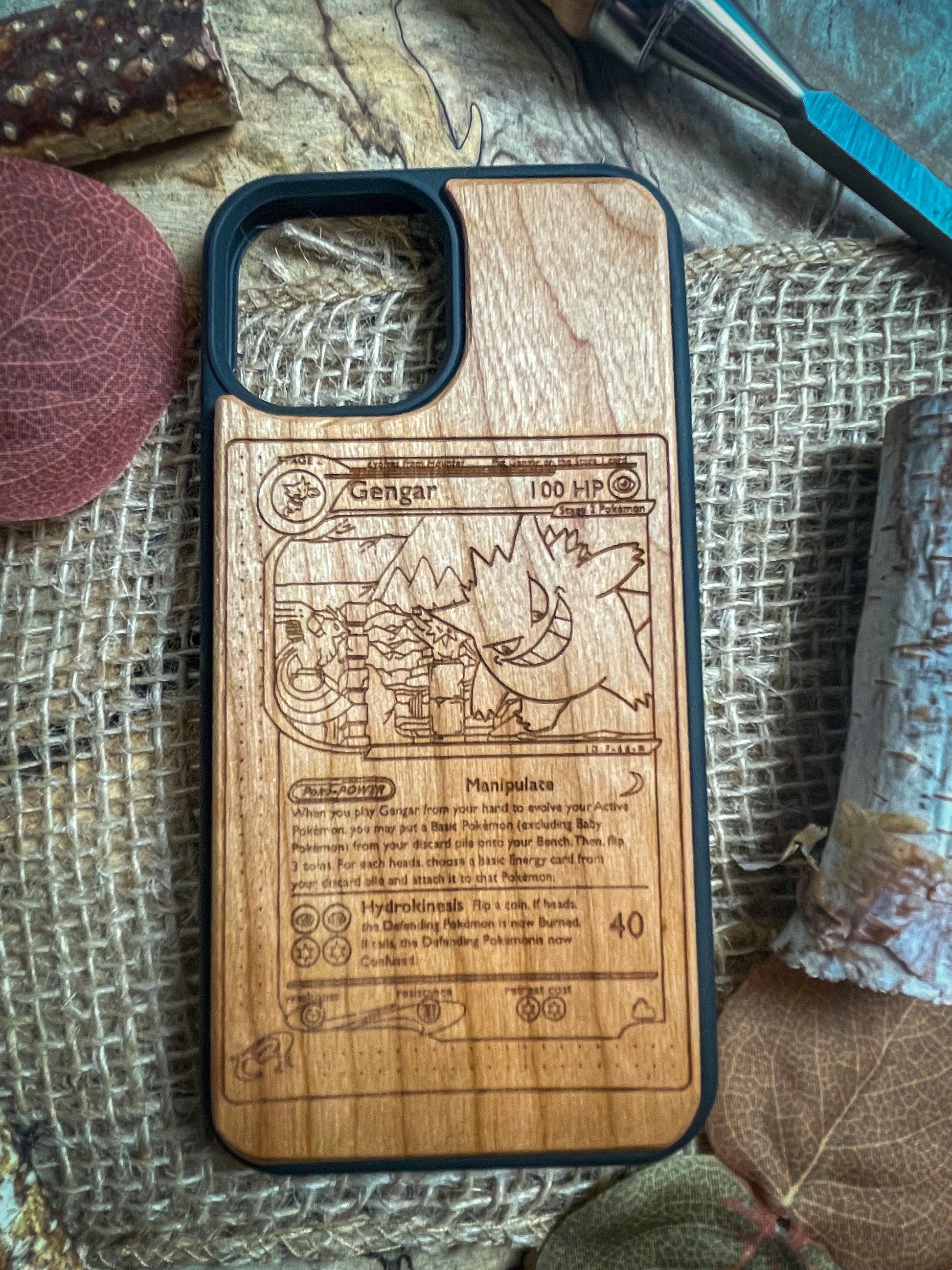 a wooden phone case with a picture of a cartoon character on it