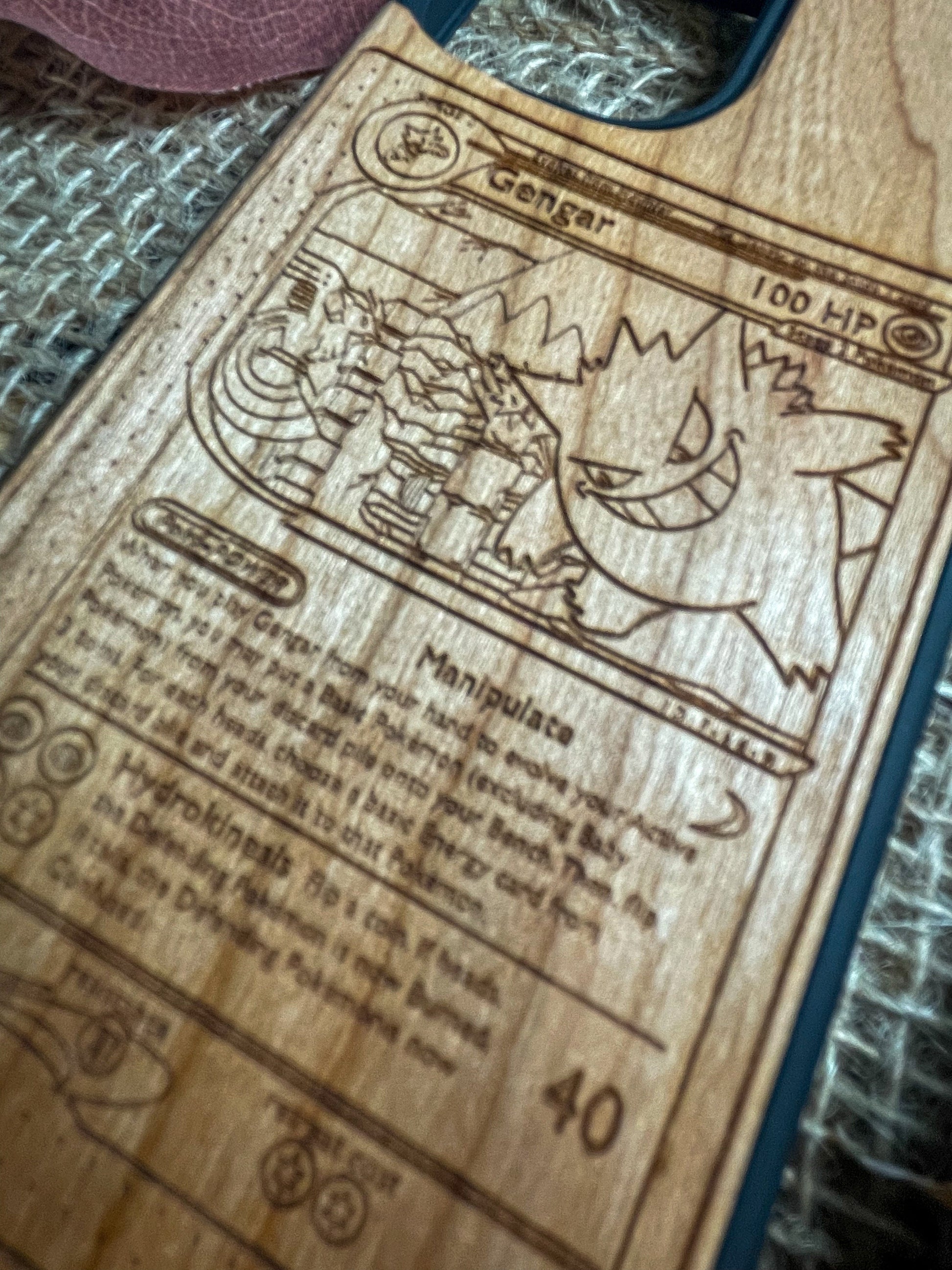 a wooden cutting board with a picture of pokemon on it