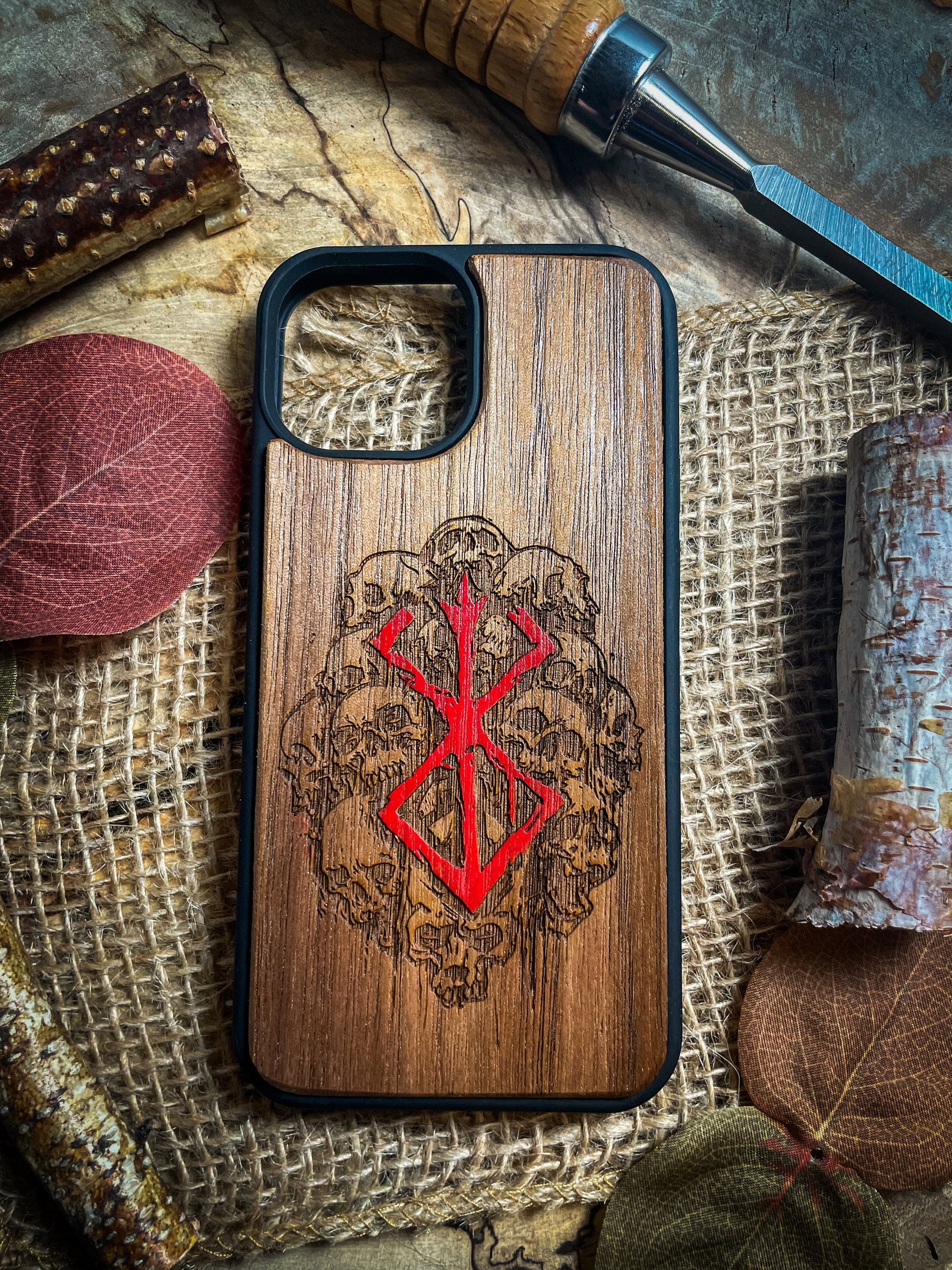 a wooden phone case sitting on top of a table