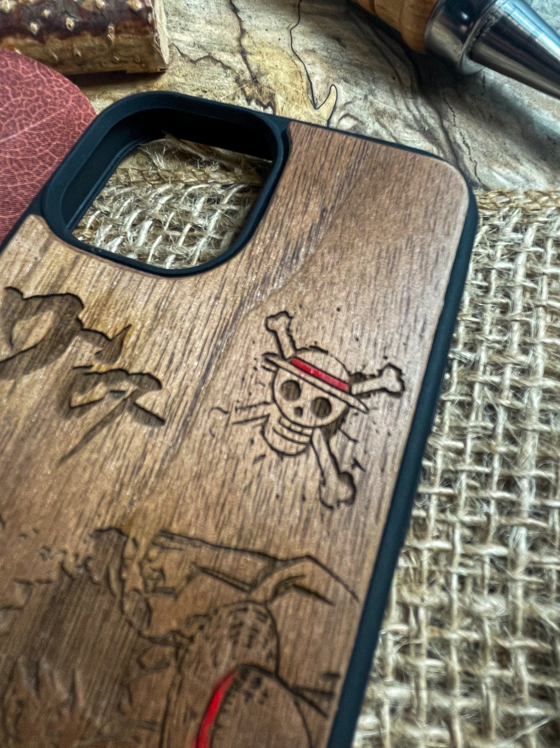 a wooden phone case with a picture of a pirate on it