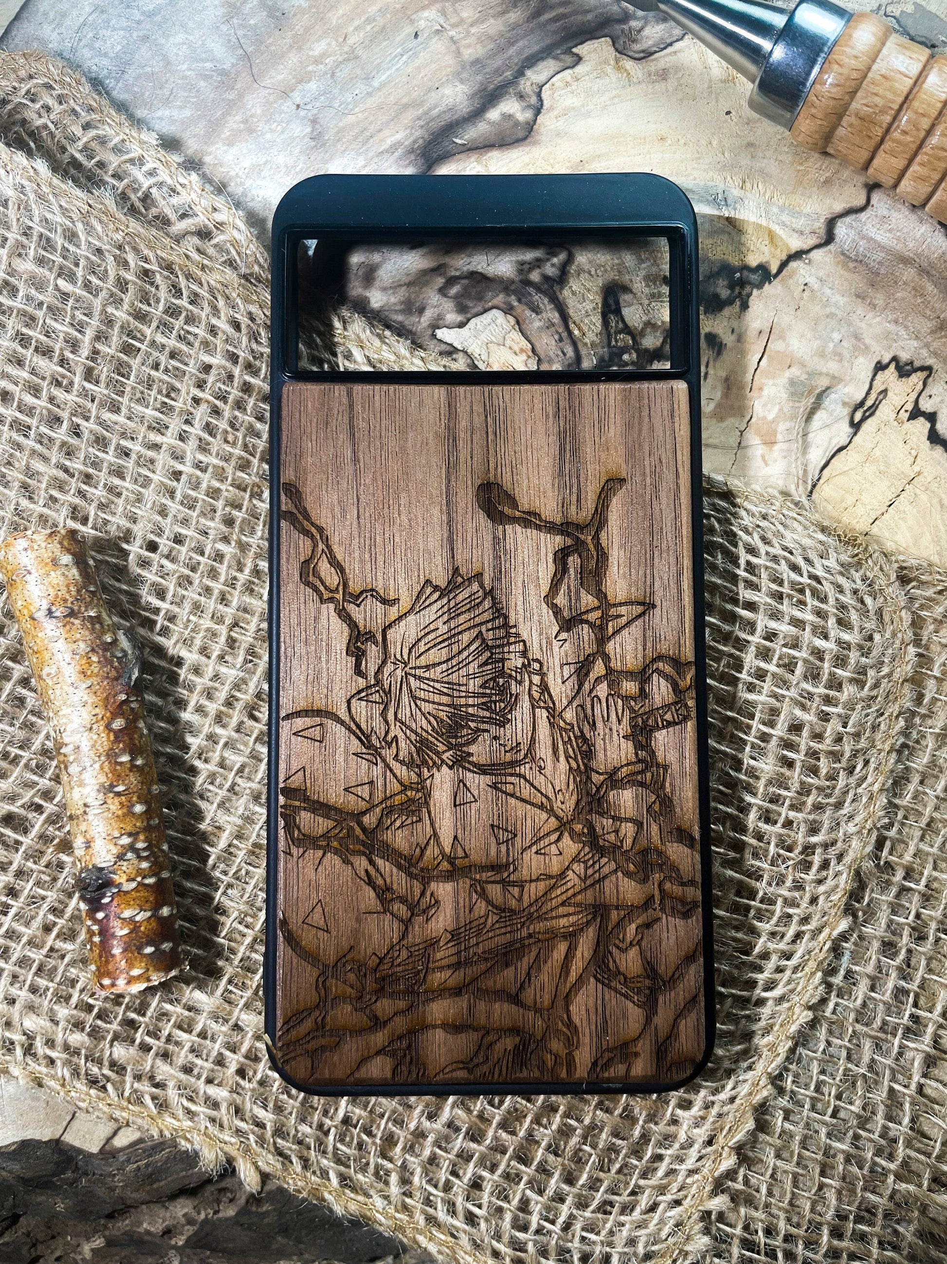 a wooden phone case sitting on top of a table