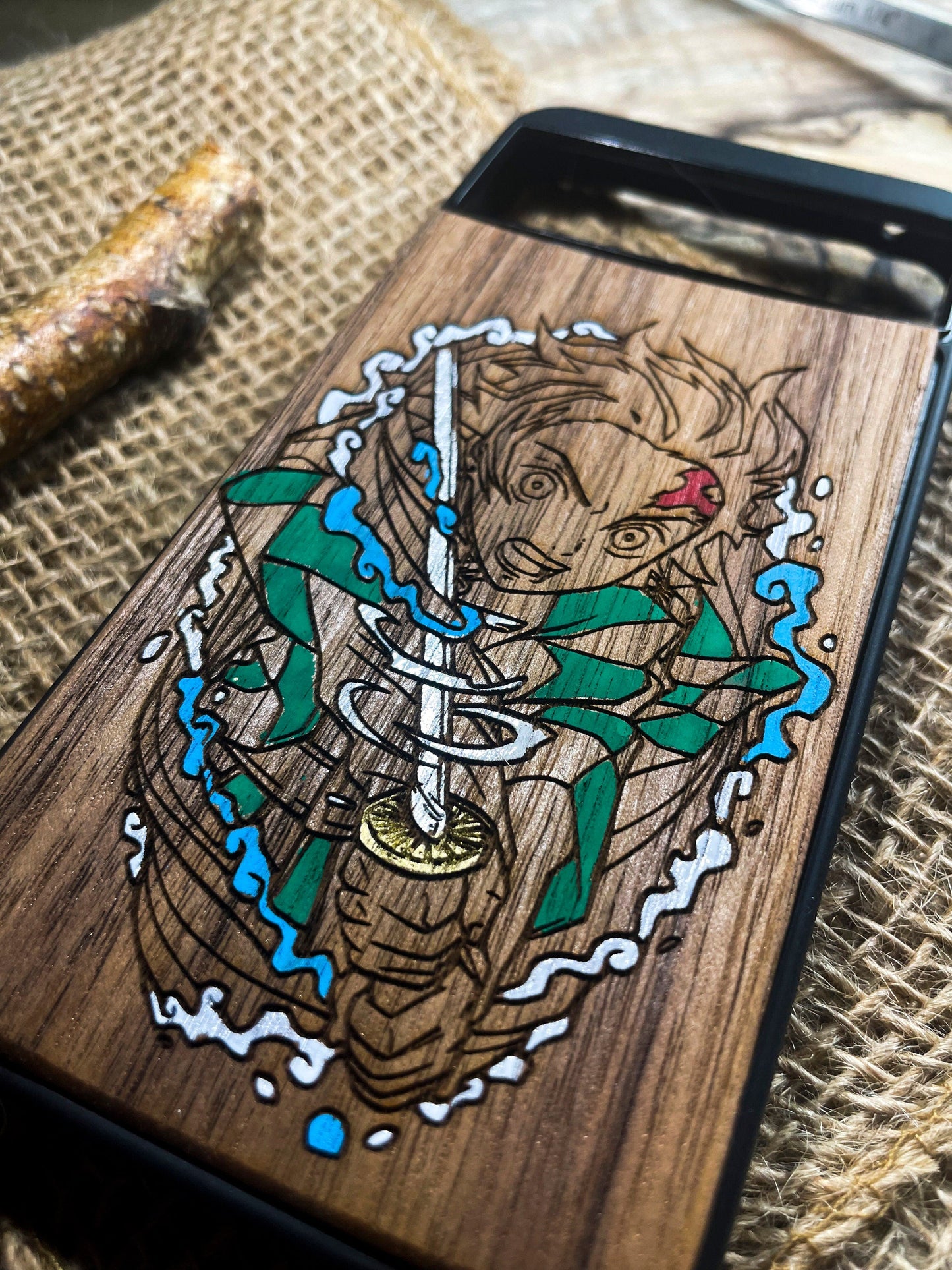 a wooden phone case with a picture of a ship on it