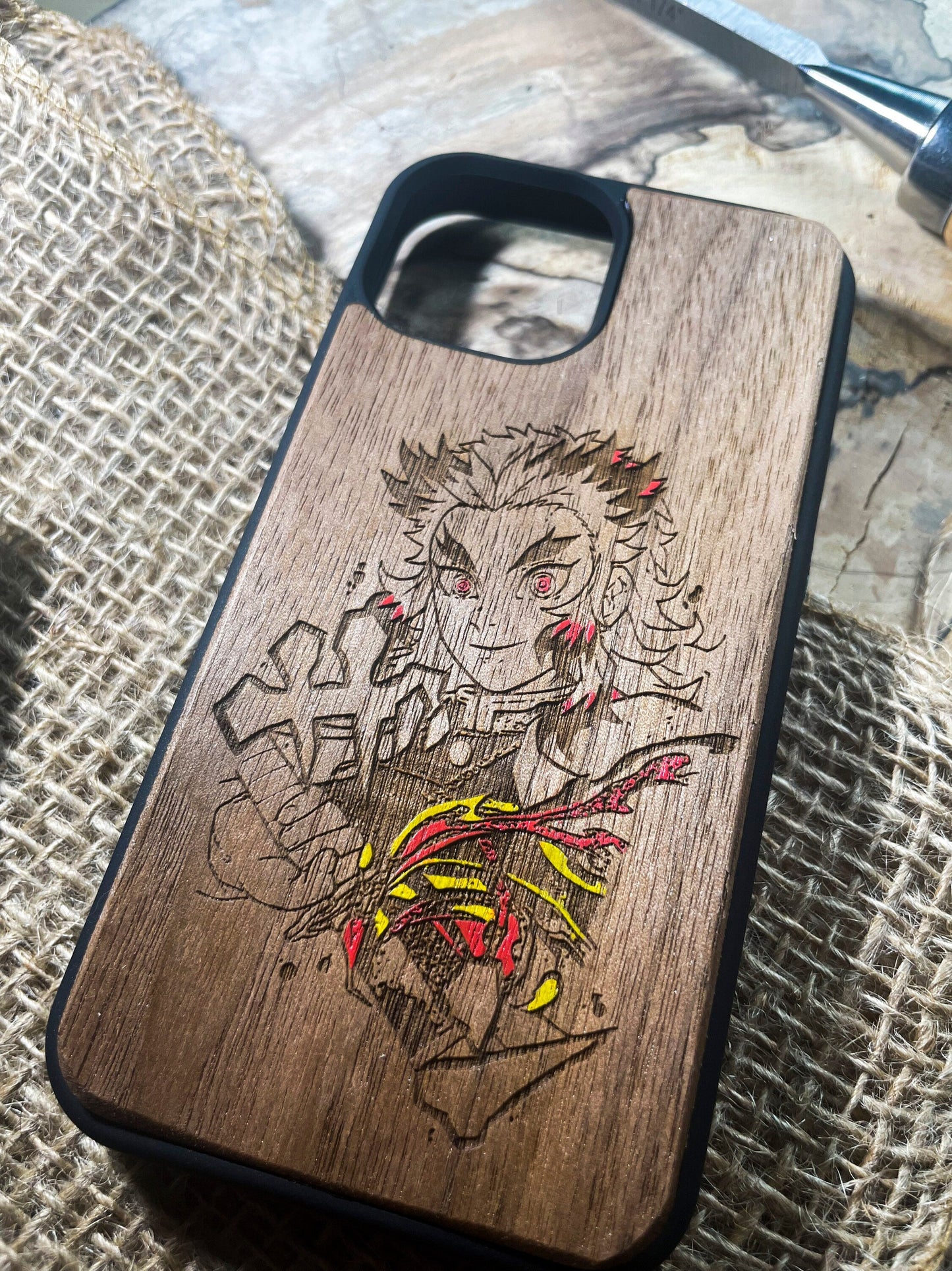 a wooden phone case with a drawing of a man on it