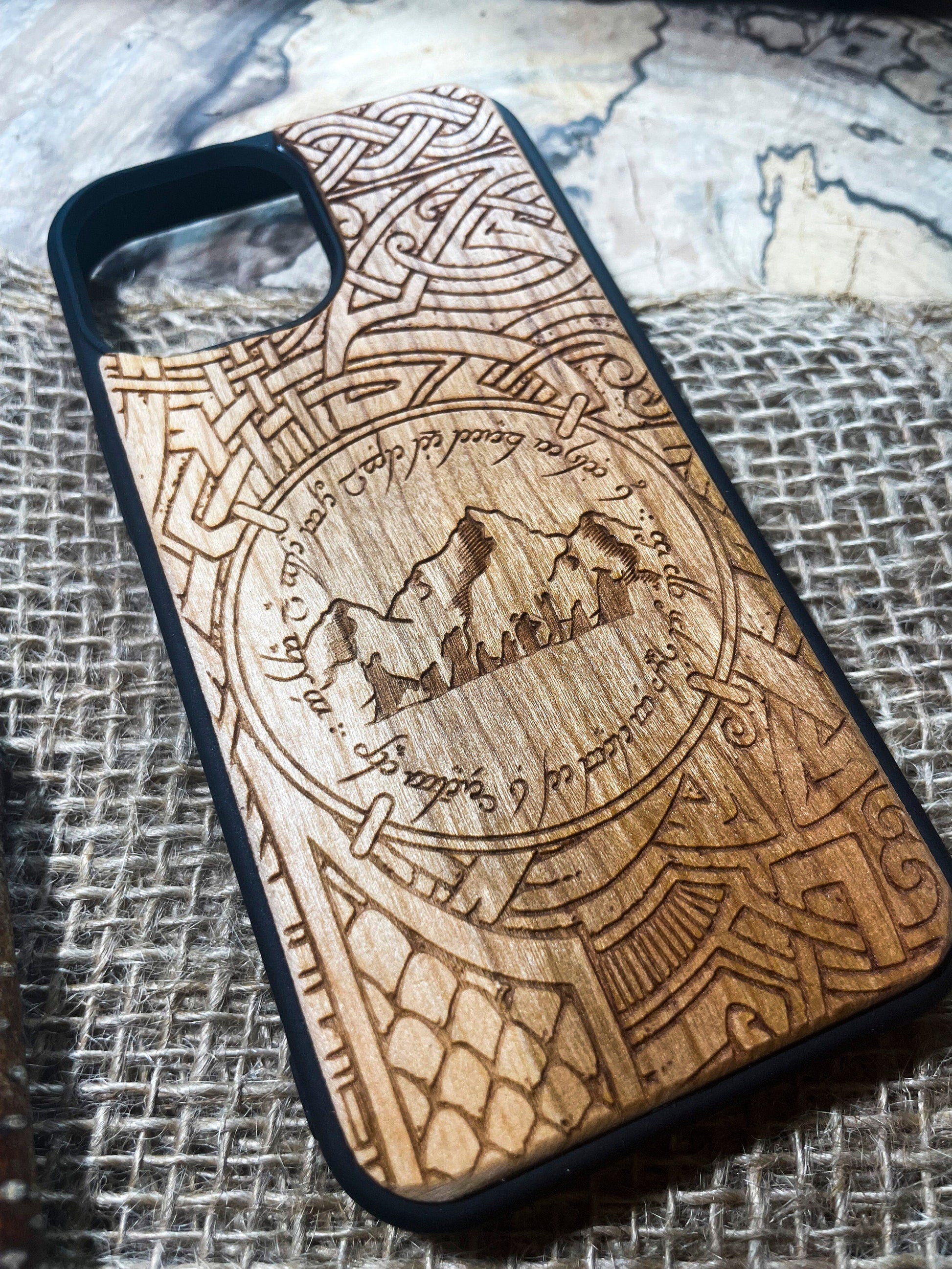 a wooden phone case with a picture of a mountain