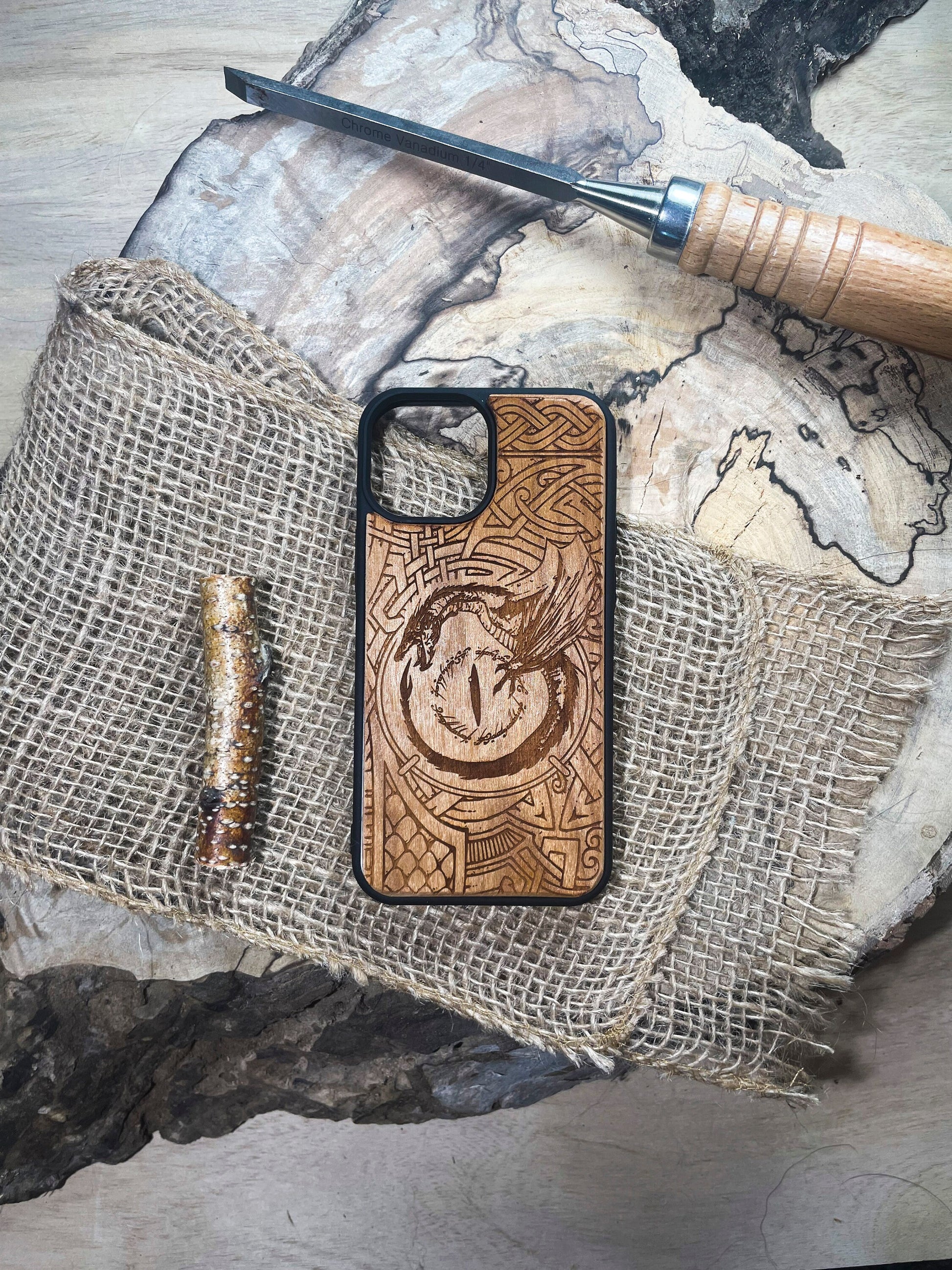 a wooden phone case with a design on it