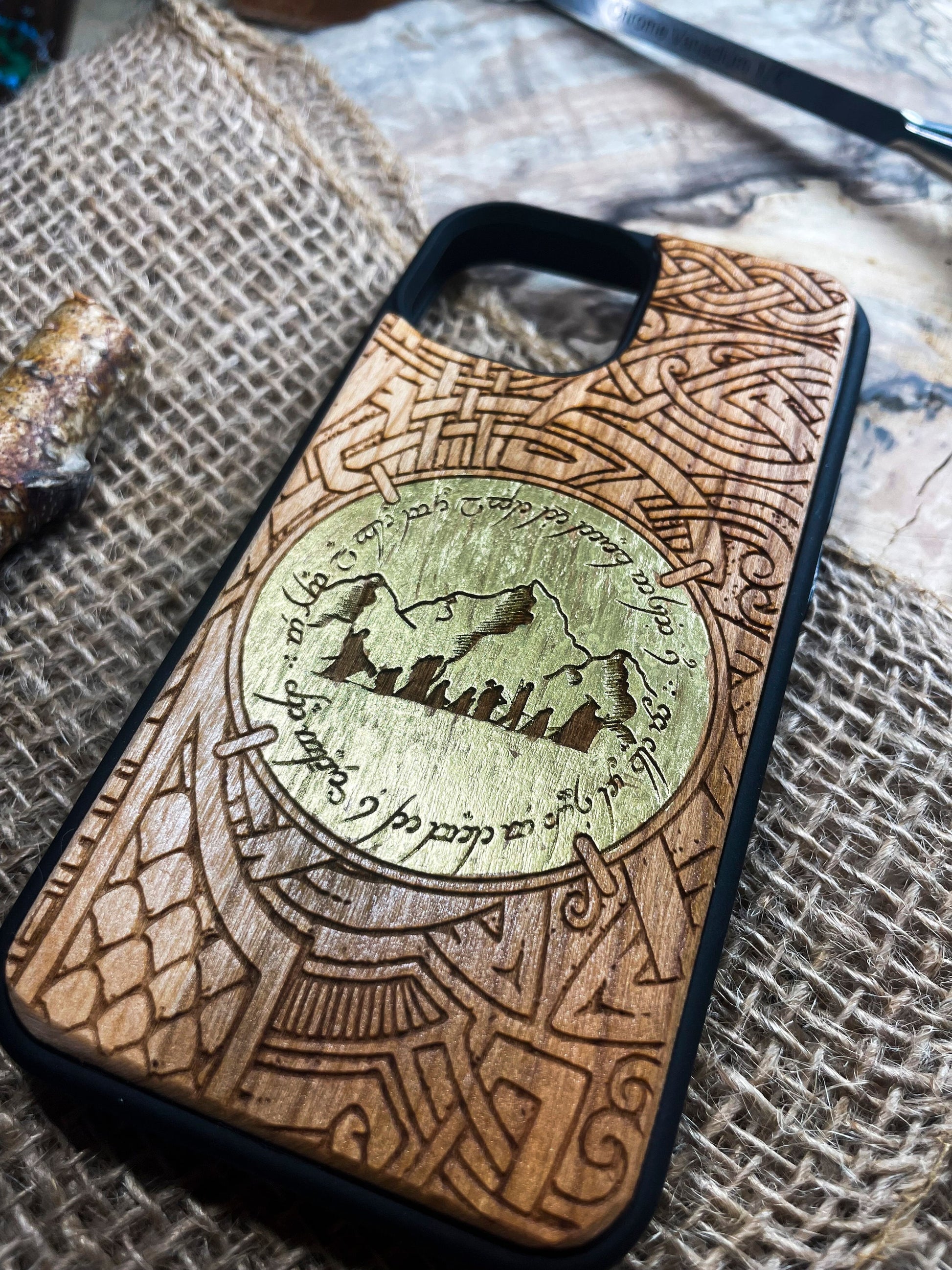 a wooden phone case with a picture of a mountain