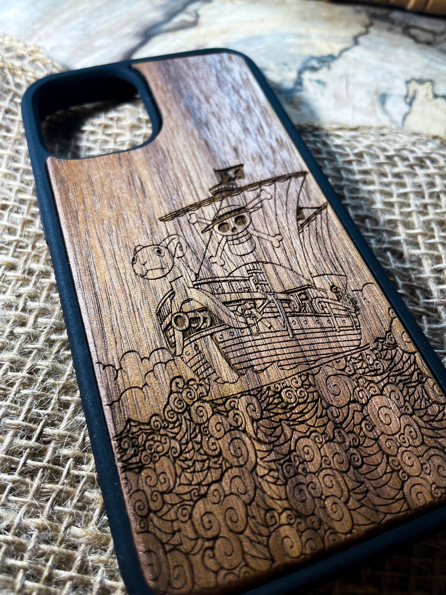 a wooden case with a picture of a pirate ship on it