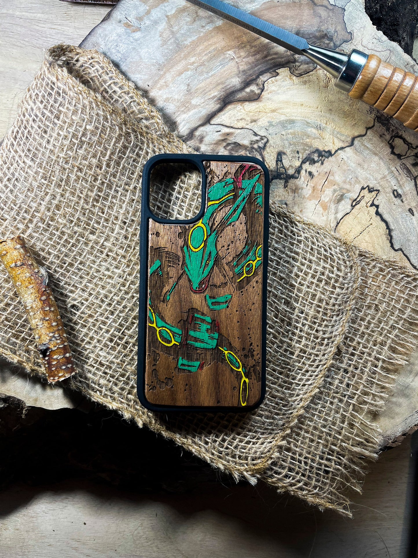 a wooden phone case with a picture of a frog on it