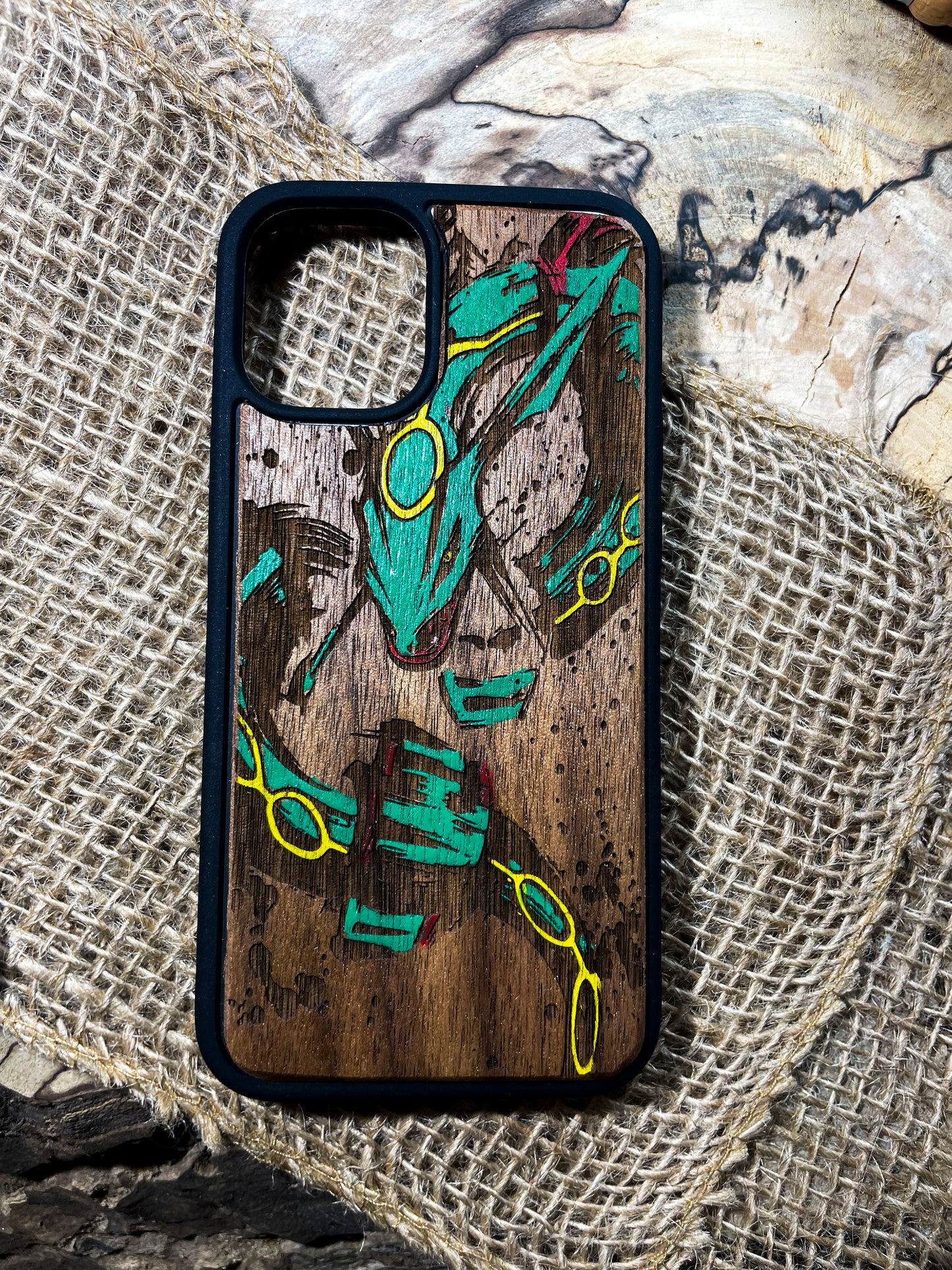 a wooden phone case with a frog on it