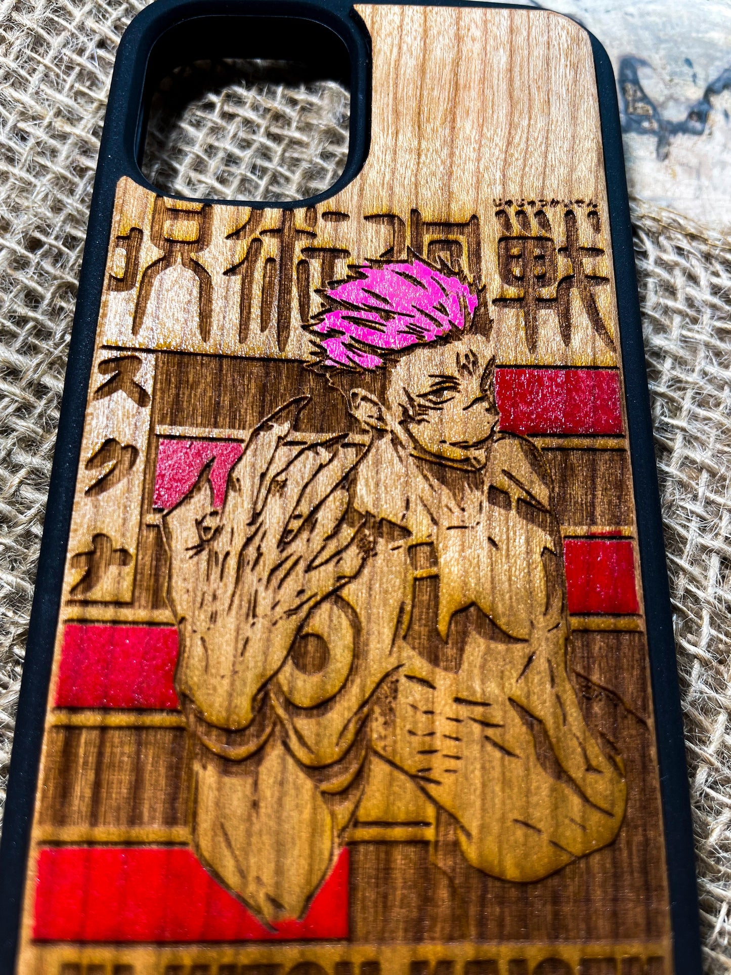 a wooden phone case with a picture of a man holding a guitar