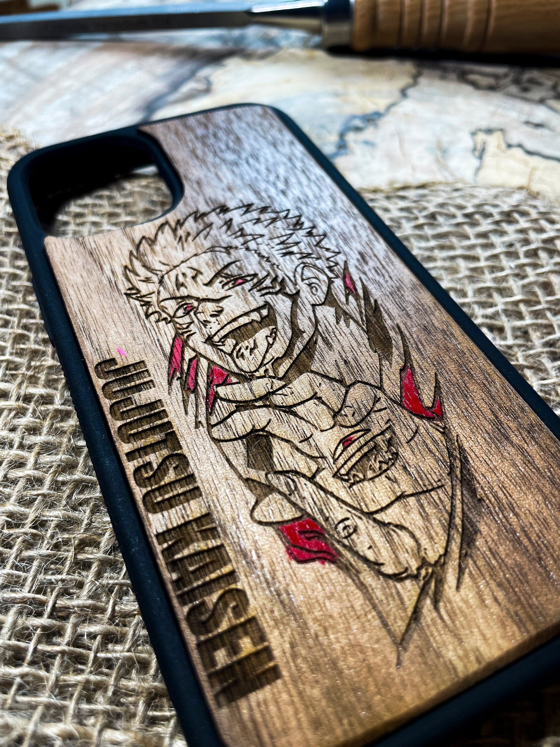 a wooden phone case with a dragon on it